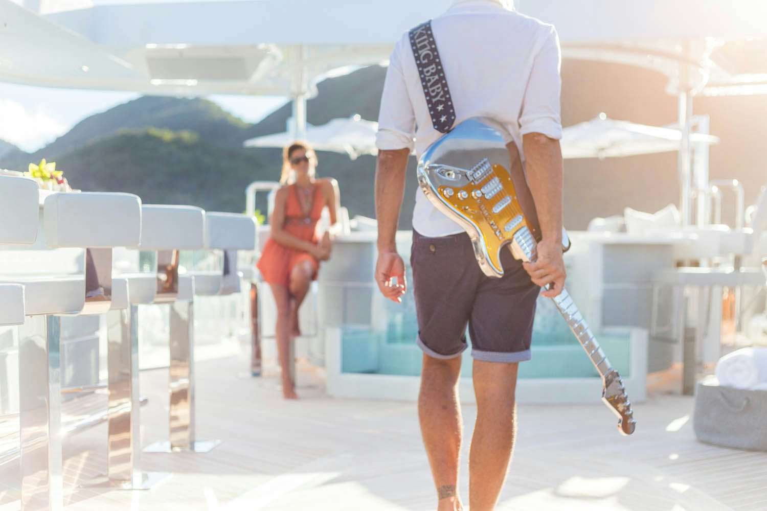 a person walking with a broom aboard KING BABY Yacht for Charter