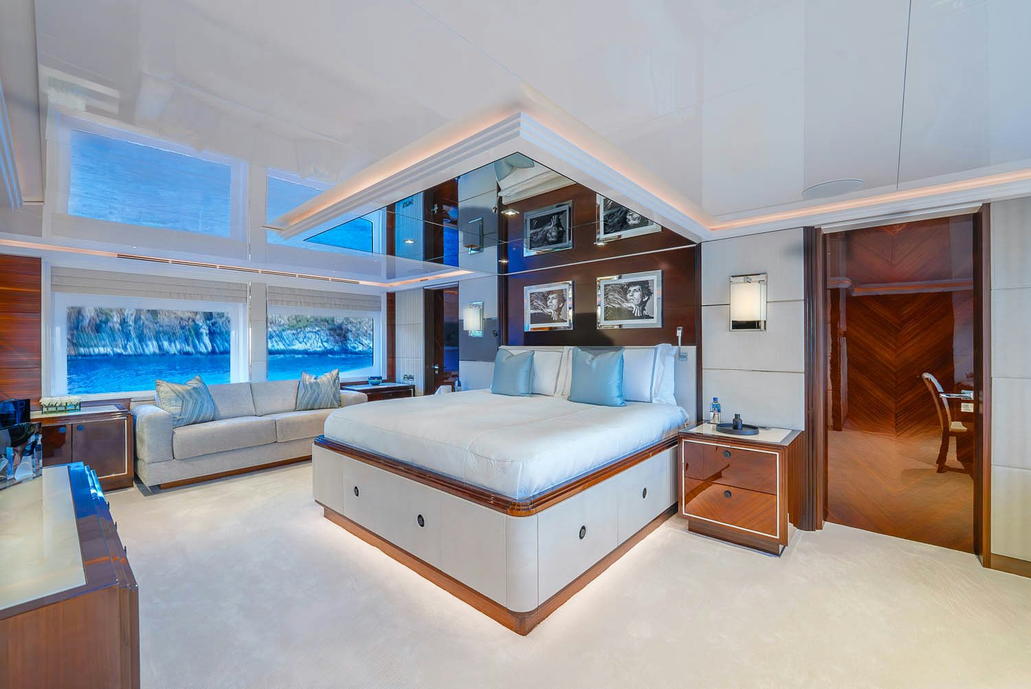 a bedroom with a bed and a couch aboard KING BABY Yacht for Charter