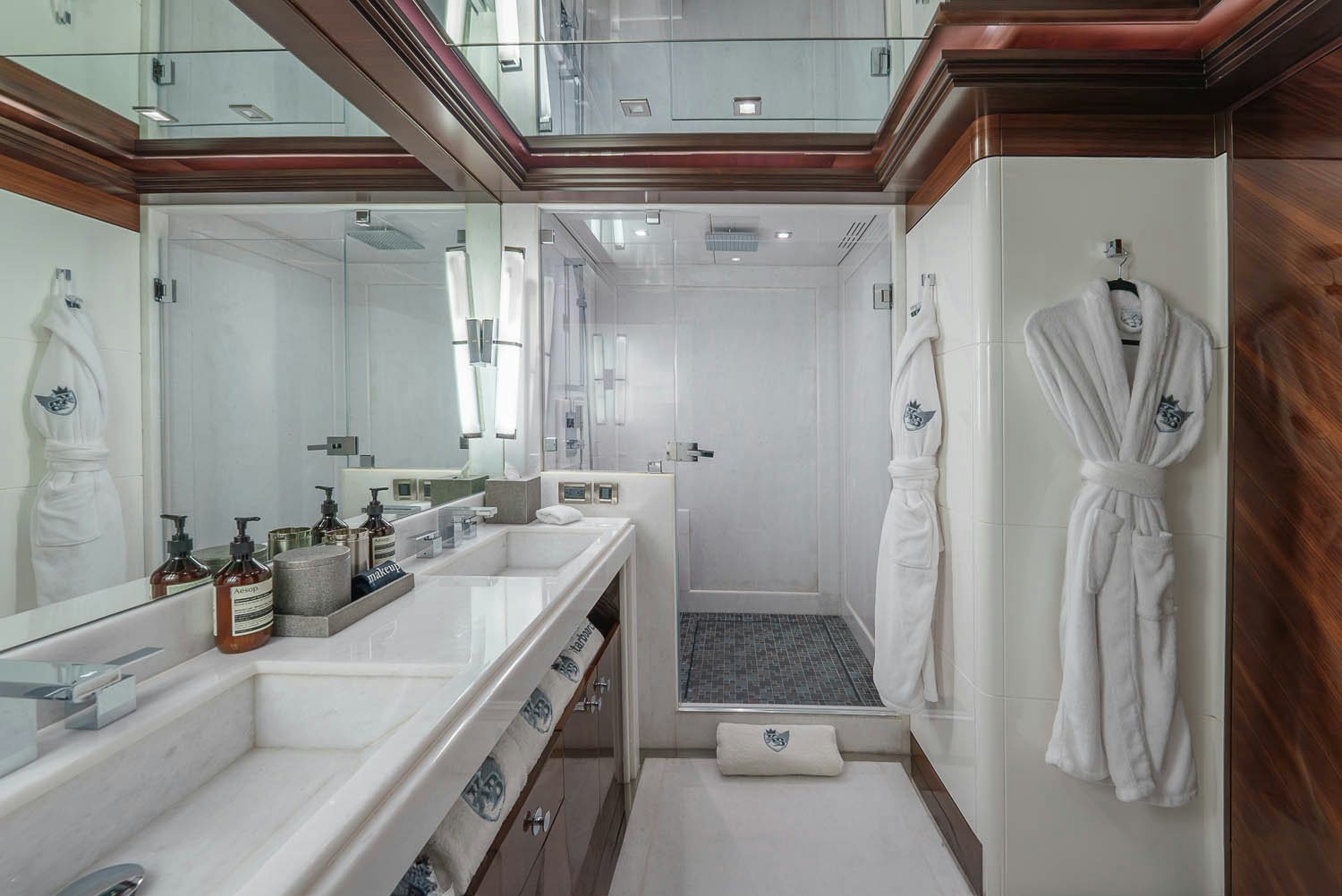 a bathroom with a robe on the wall aboard KING BABY Yacht for Charter