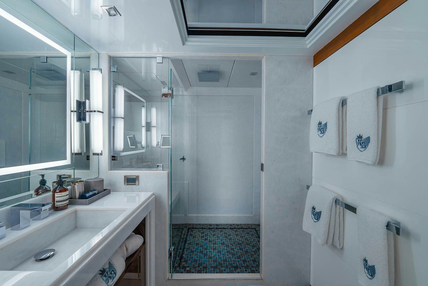 a bathroom with a sink and a mirror aboard KING BABY Yacht for Charter