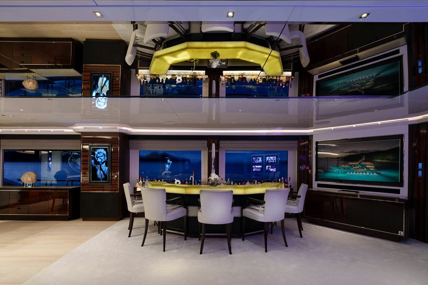 a room with a table and chairs aboard KING BABY Yacht for Charter