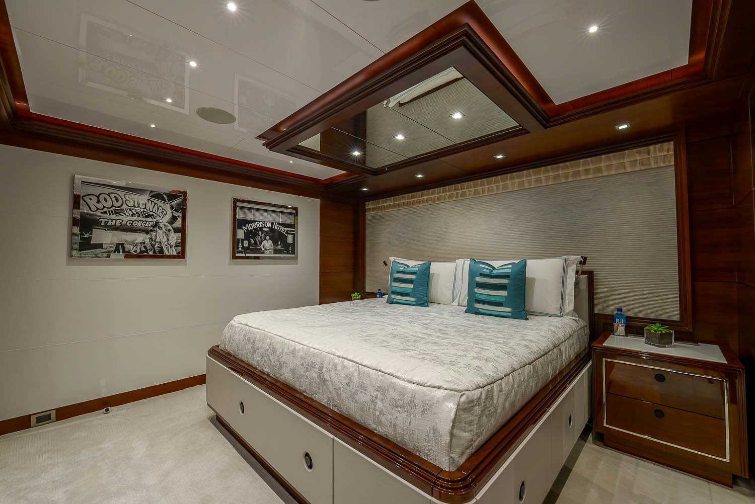 a bedroom with a bed and a ceiling fan aboard KING BABY Yacht for Charter