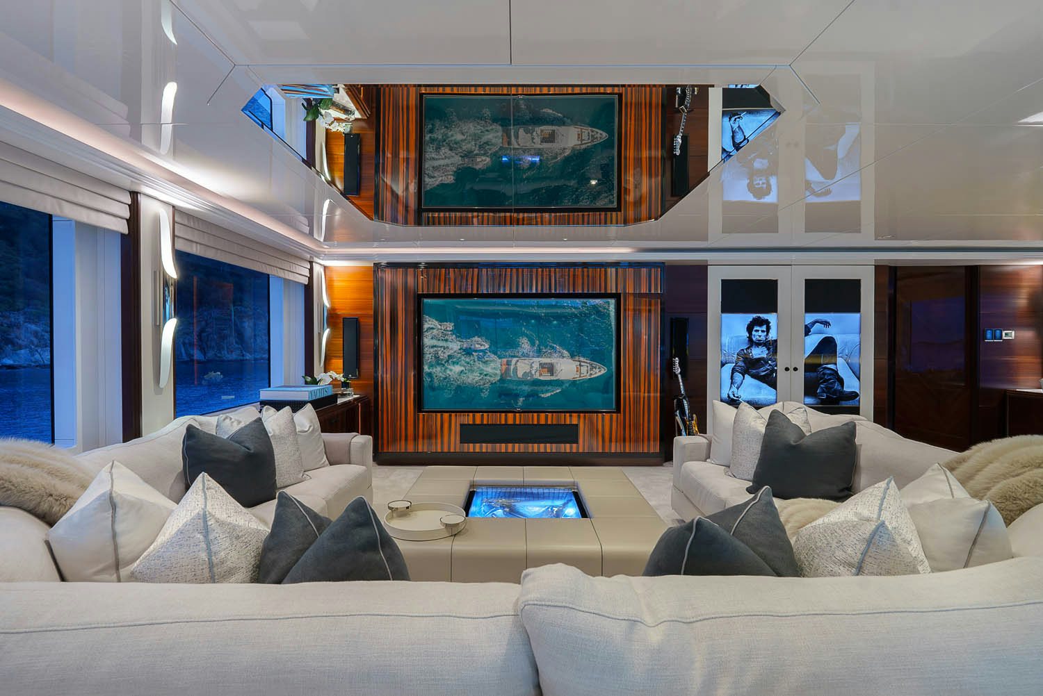 a living room with a large screen aboard KING BABY Yacht for Charter