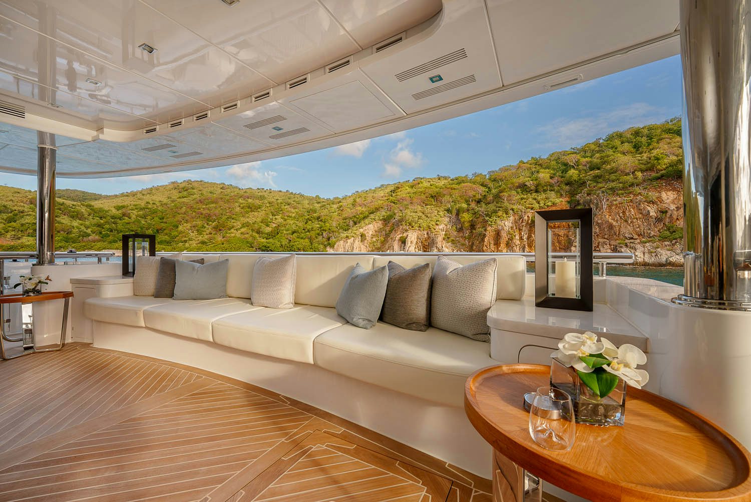 a large white couch sits in a living room aboard KING BABY Yacht for Charter