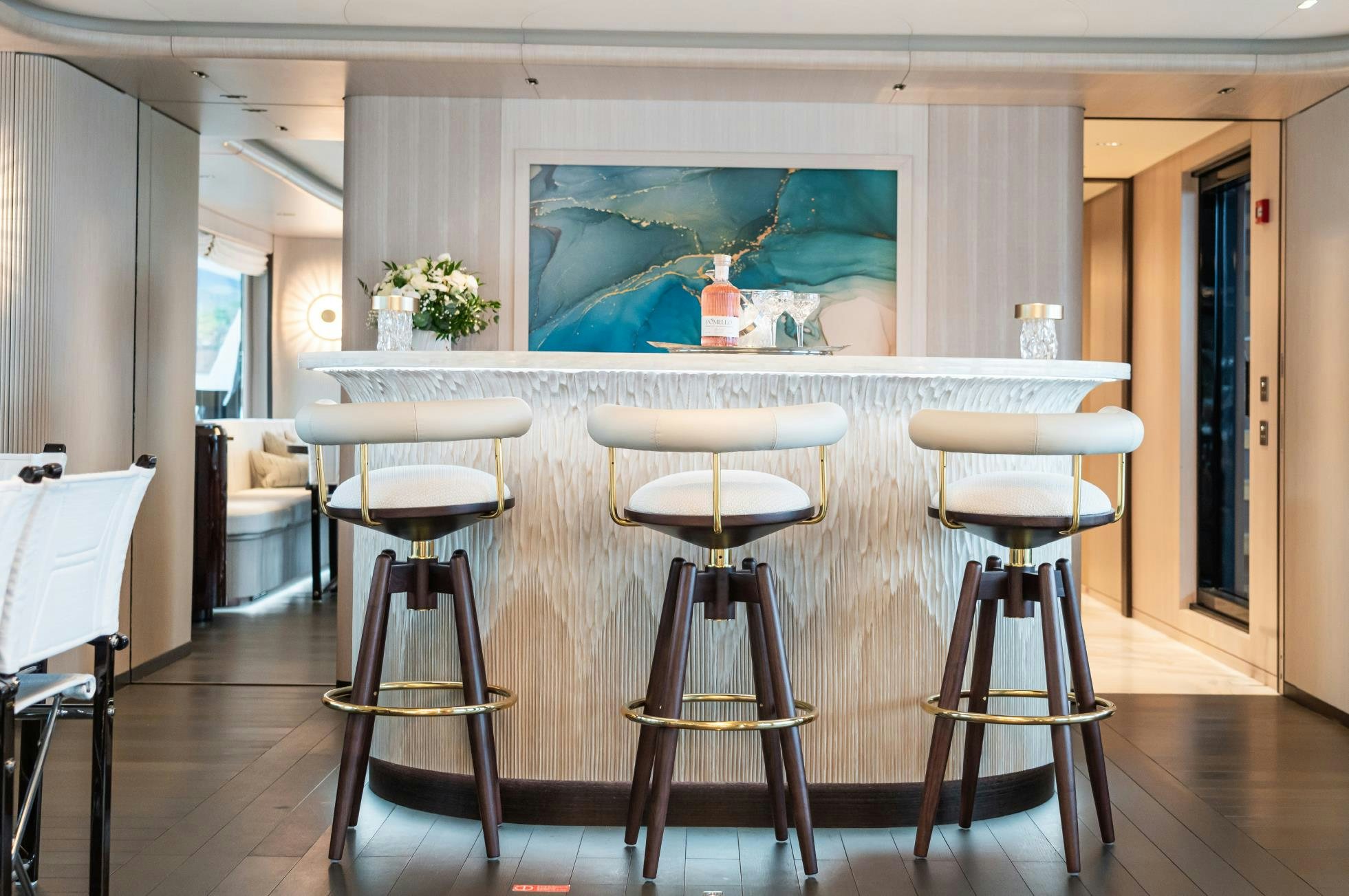 a room with stools and stools aboard M Yacht for Sale