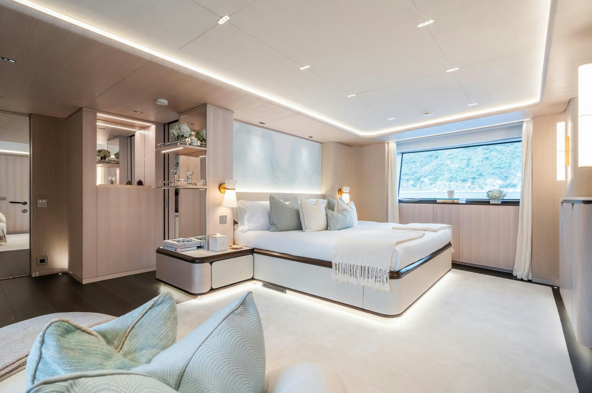 a bedroom with a bed and a desk aboard M Yacht for Sale