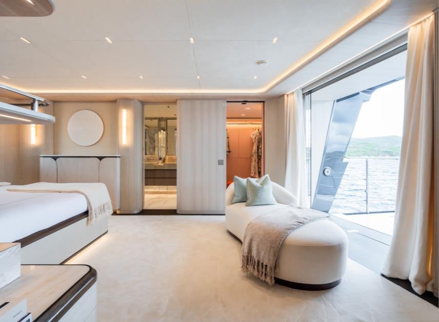 a room with a bed and a window aboard M Yacht for Sale