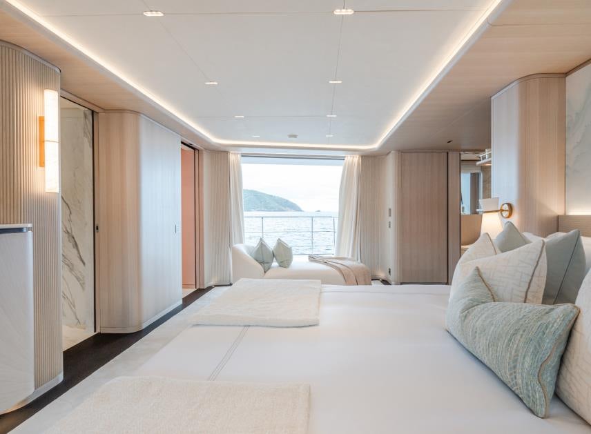 a large white bed in a room aboard M Yacht for Sale