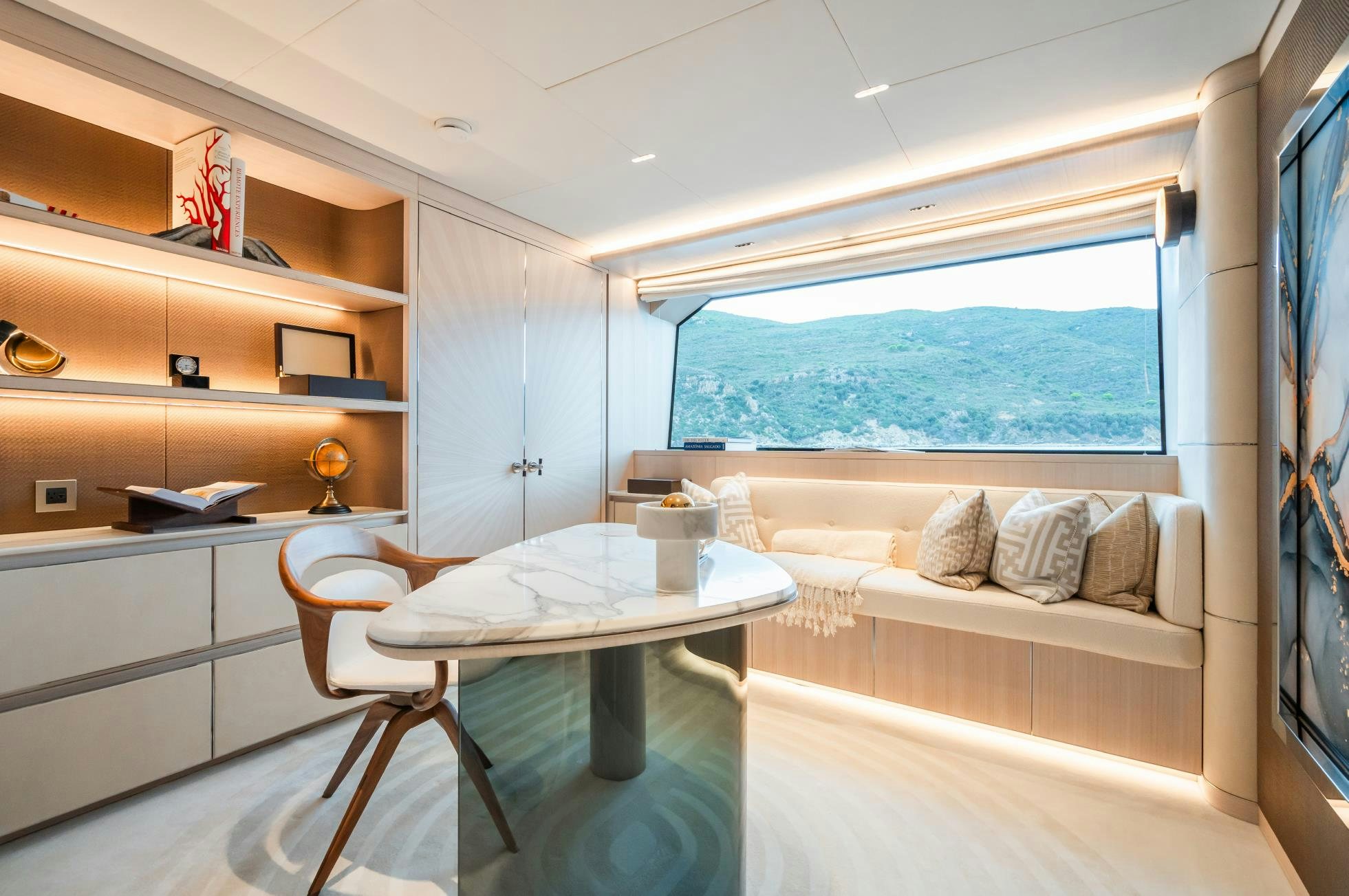 a room with a table and a bed aboard M Yacht for Sale