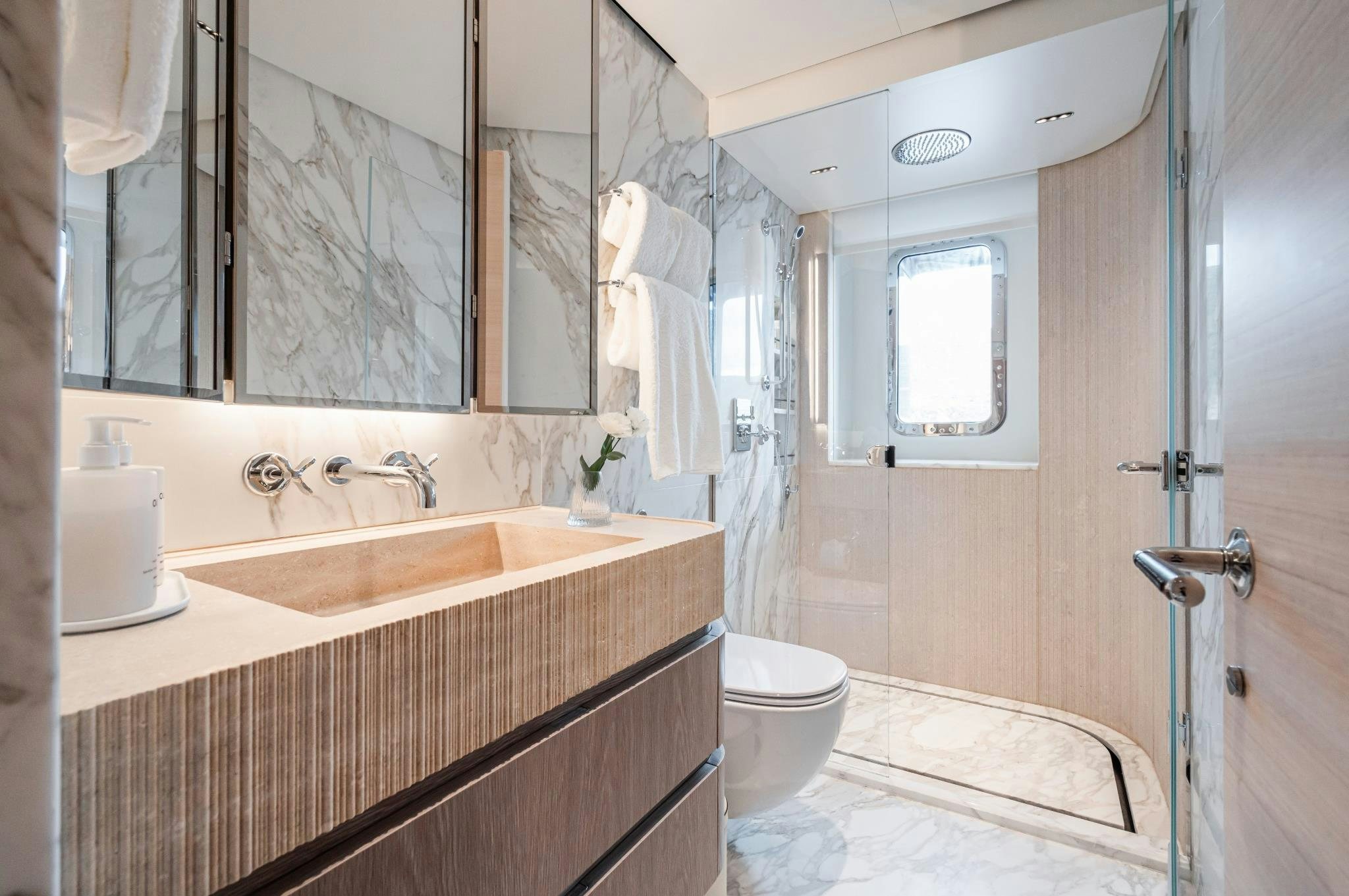 a bathroom with a sink toilet and a bathtub aboard M Yacht for Sale