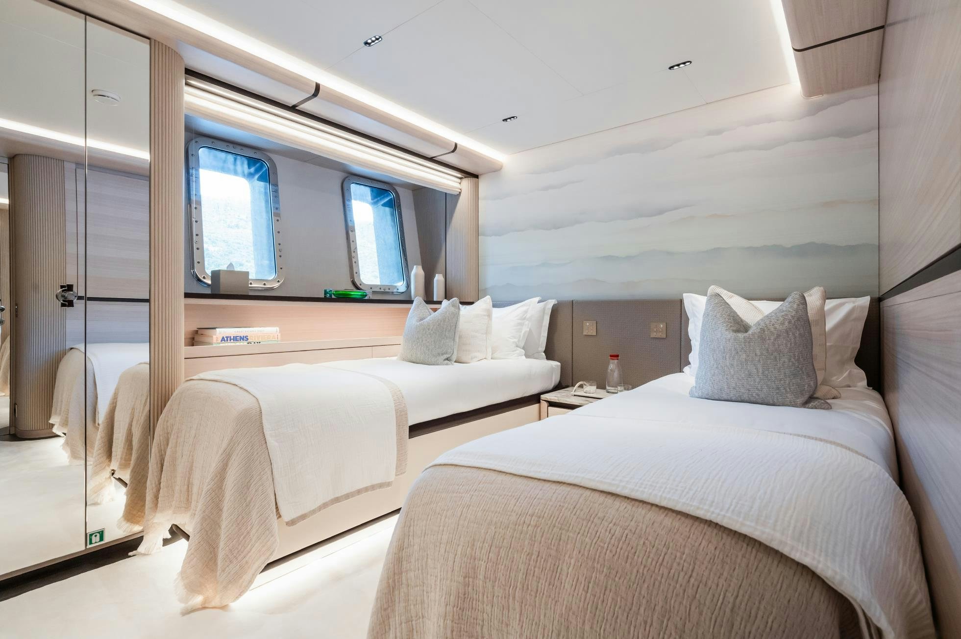 a couple of beds in a room aboard M Yacht for Sale