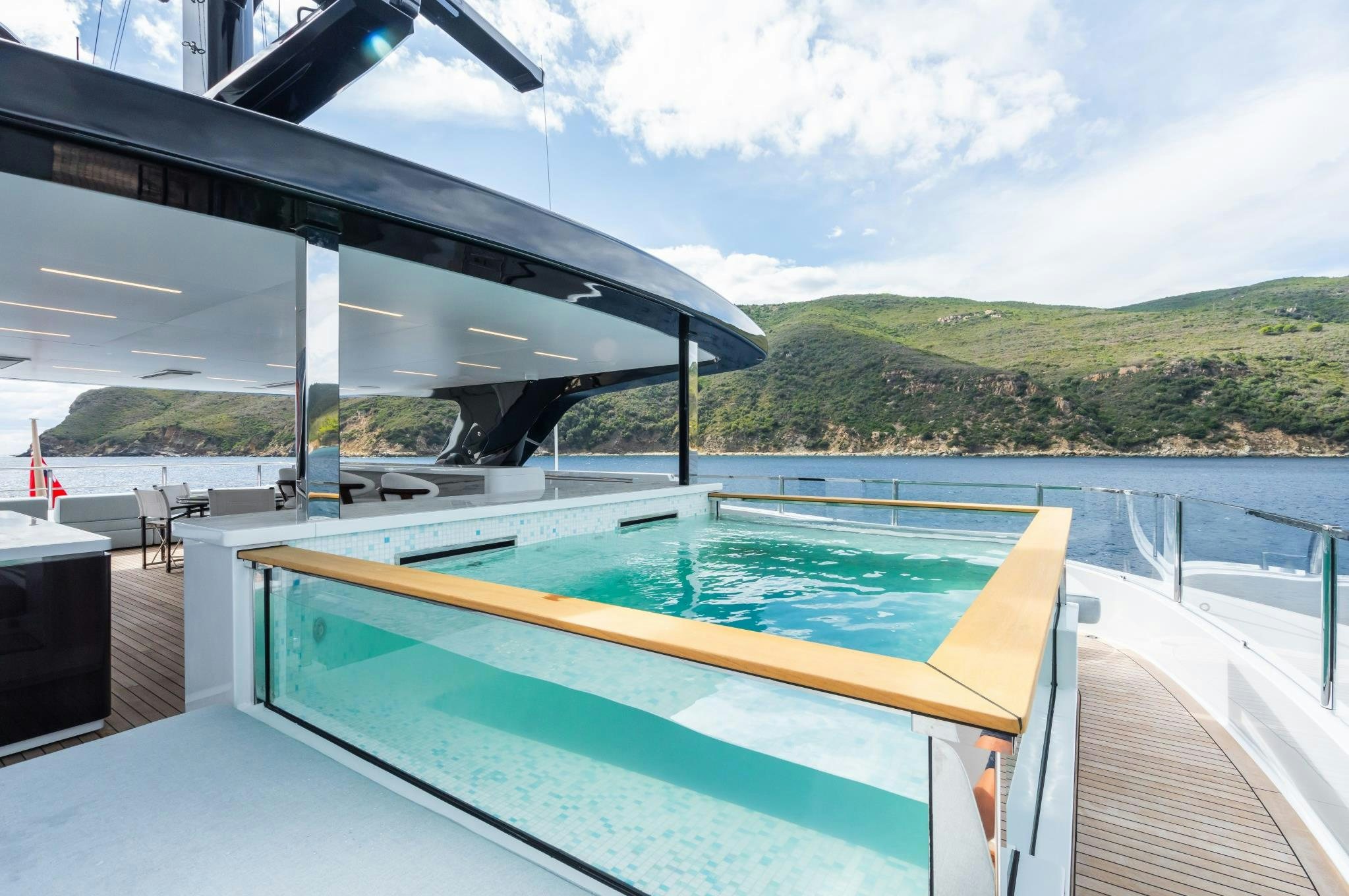 a swimming pool on a deck aboard M Yacht for Sale