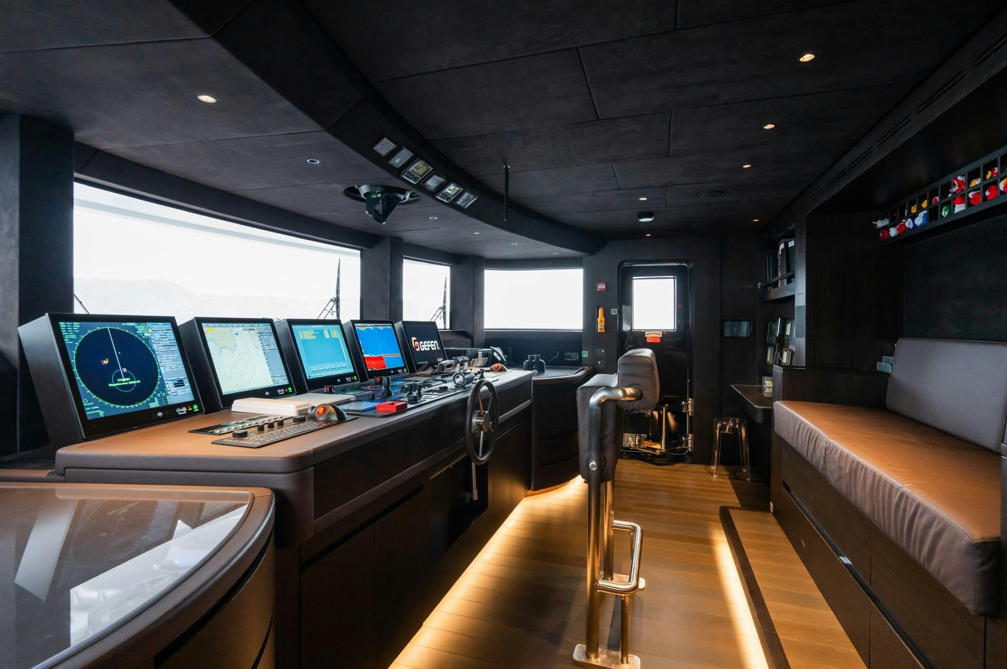 a room with computers and monitors aboard M Yacht for Sale