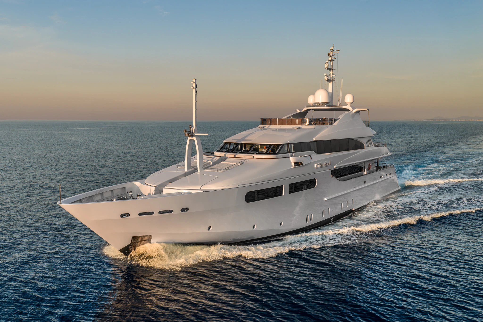 a large white ship aboard TITIAN PEARL Yacht for Sale