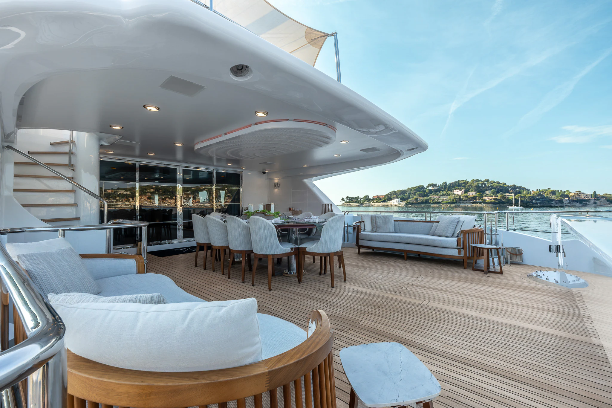 a large lounge area with a large patio and a pool aboard TITIAN PEARL Yacht for Sale