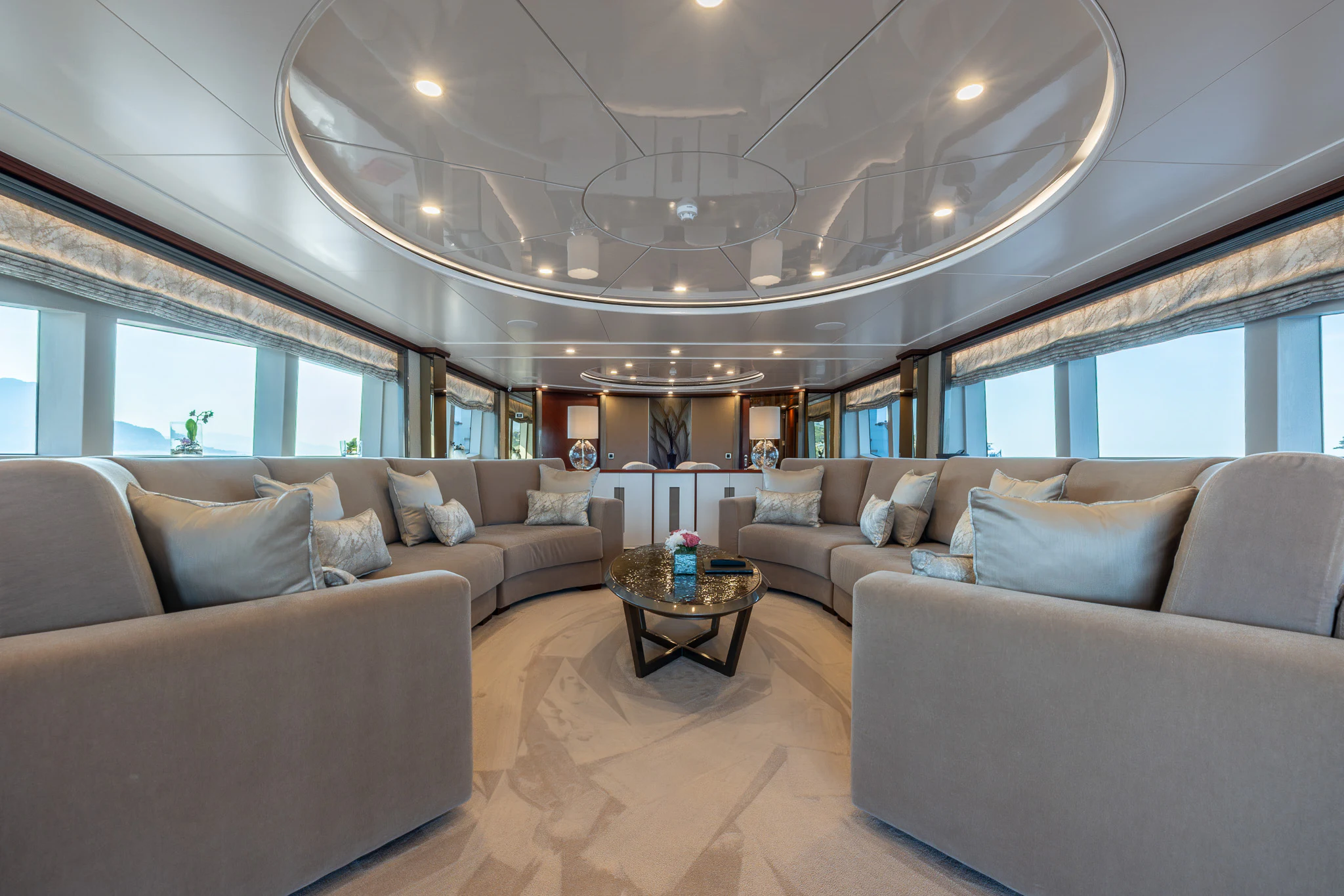 a living room with couches and a table aboard TITIAN PEARL Yacht for Sale