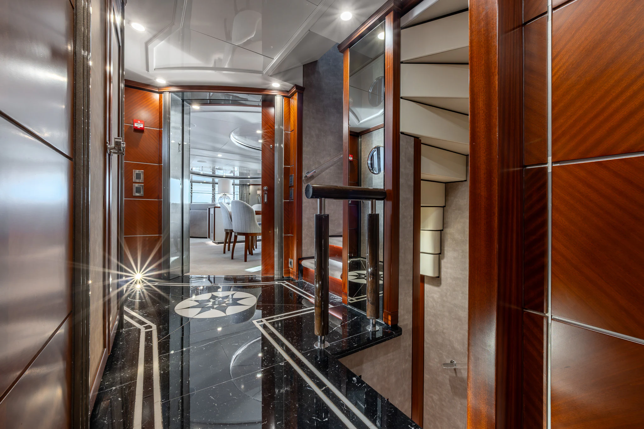 a room with glass walls and a glass door aboard TITIAN PEARL Yacht for Sale