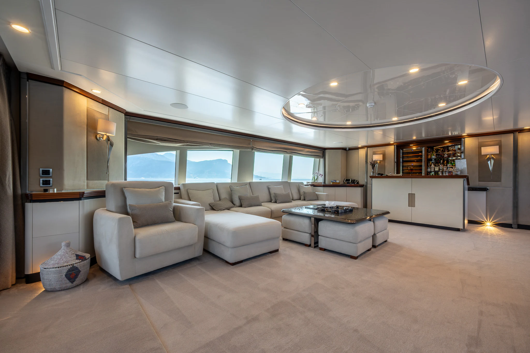 a living room with a large window aboard TITIAN PEARL Yacht for Sale