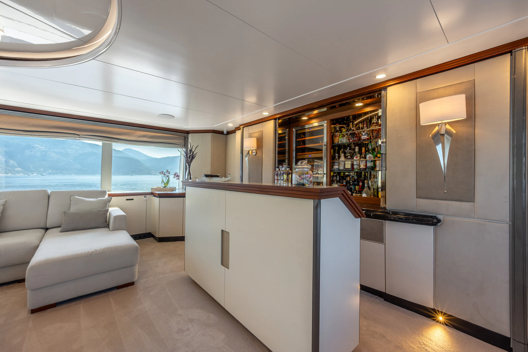 a room with a couch and a table aboard TITIAN PEARL Yacht for Sale