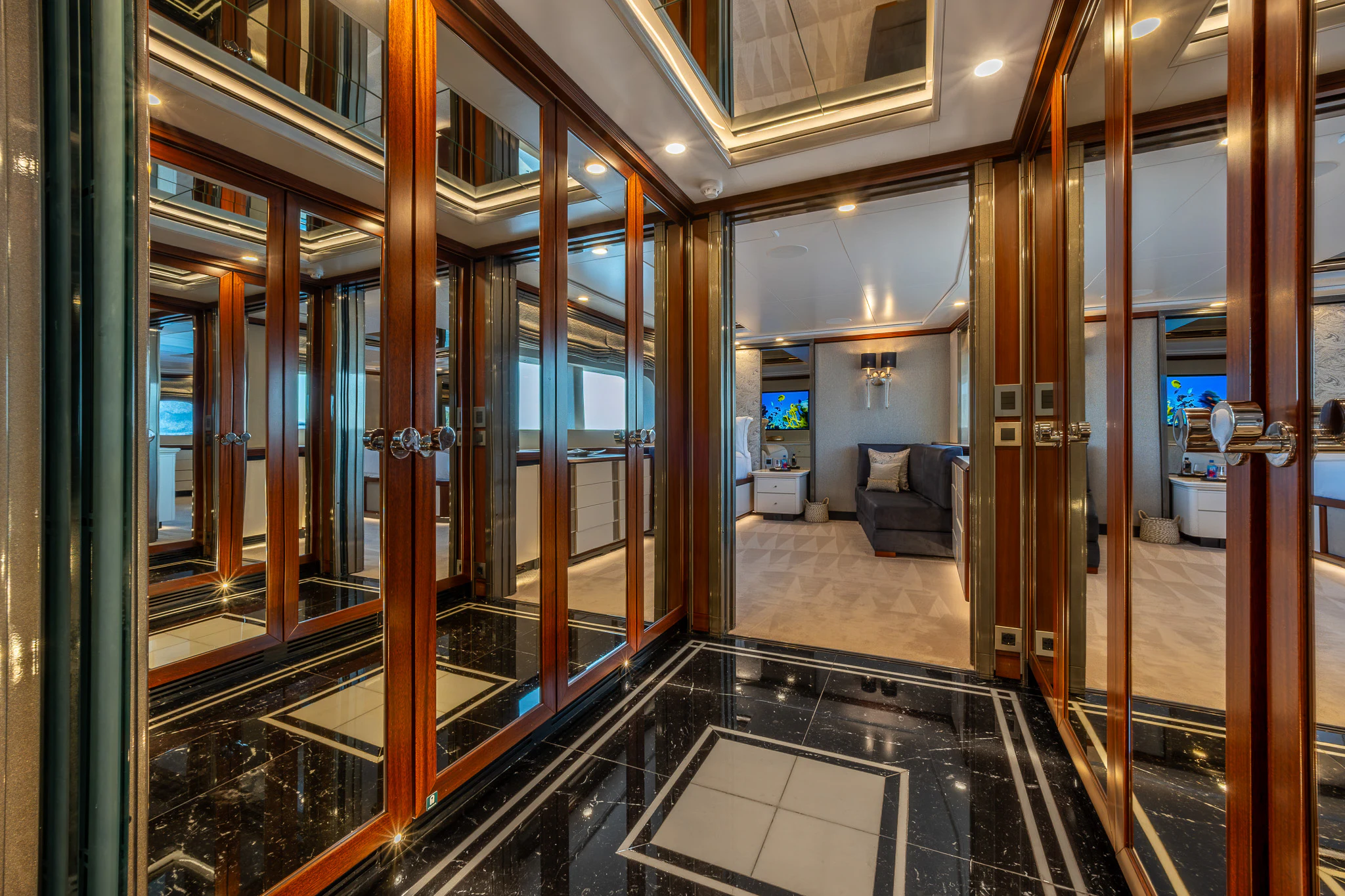 a large room with glass walls aboard TITIAN PEARL Yacht for Sale