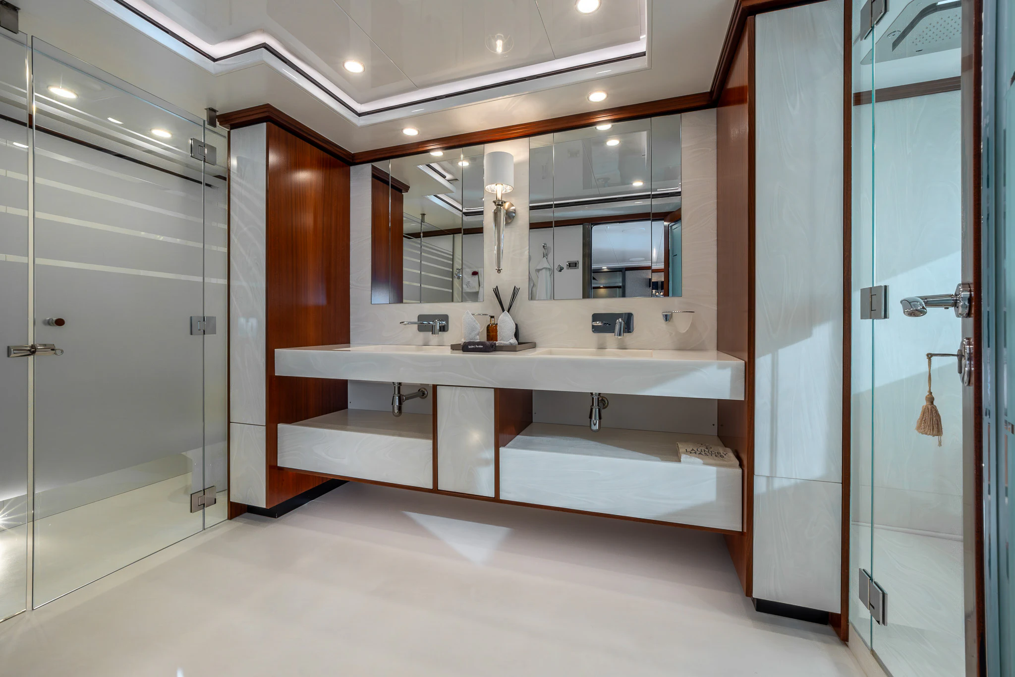 a bathroom with a large mirror aboard TITIAN PEARL Yacht for Sale