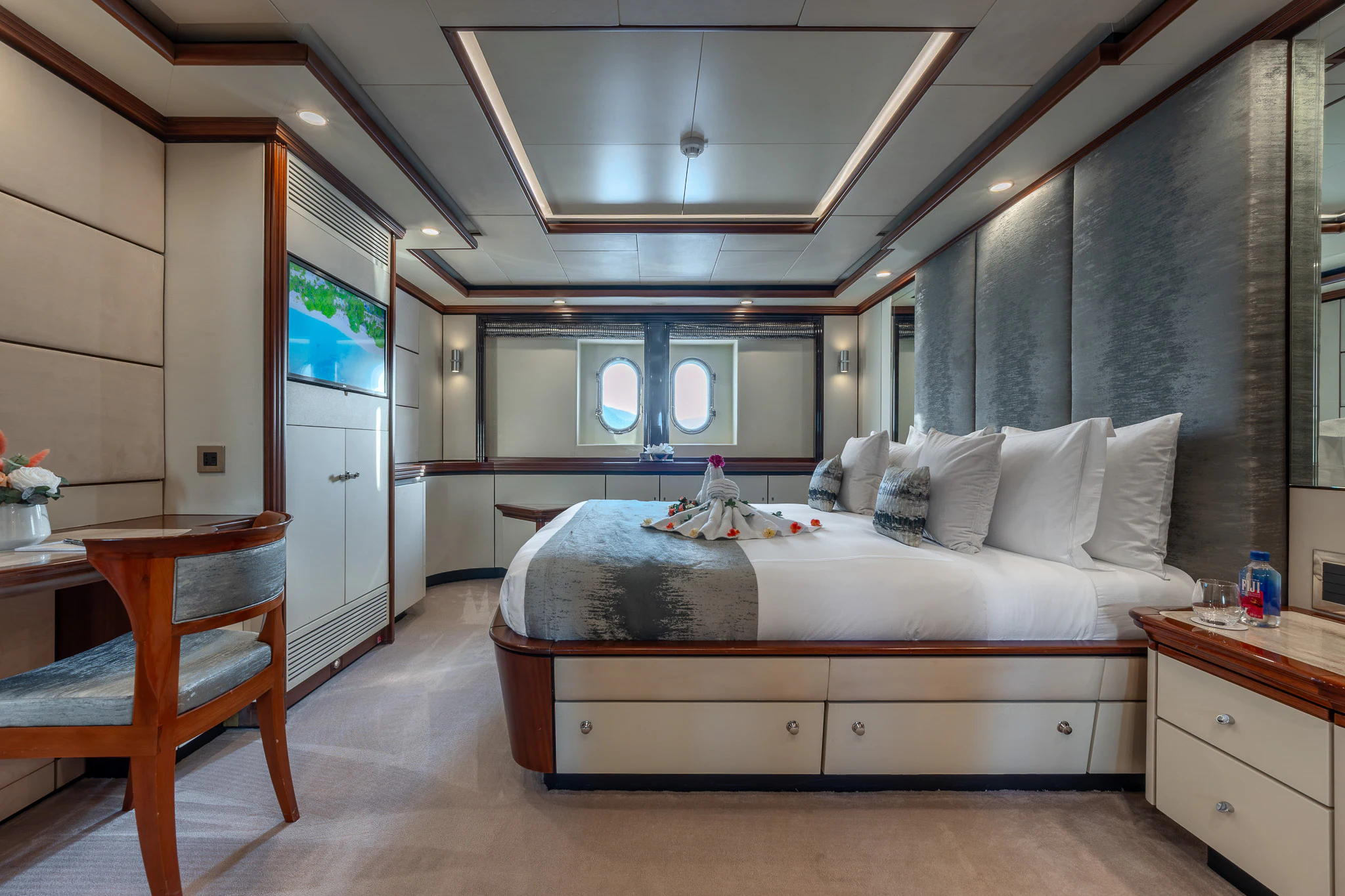 a bed in a room aboard TITIAN PEARL Yacht for Sale