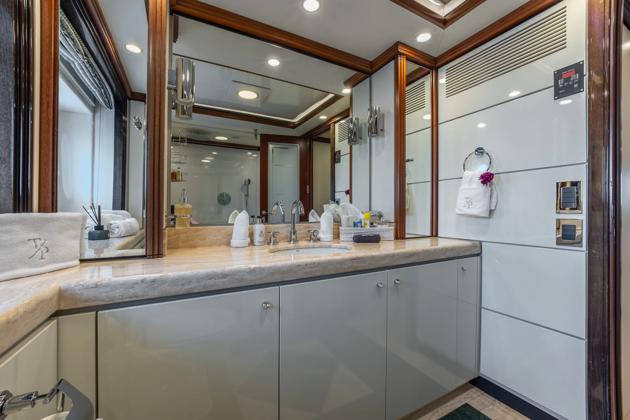 a bathroom with a large mirror aboard TITIAN PEARL Yacht for Sale
