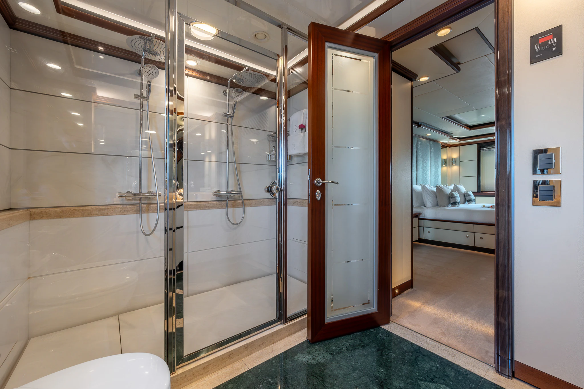 a bathroom with a glass shower aboard TITIAN PEARL Yacht for Sale