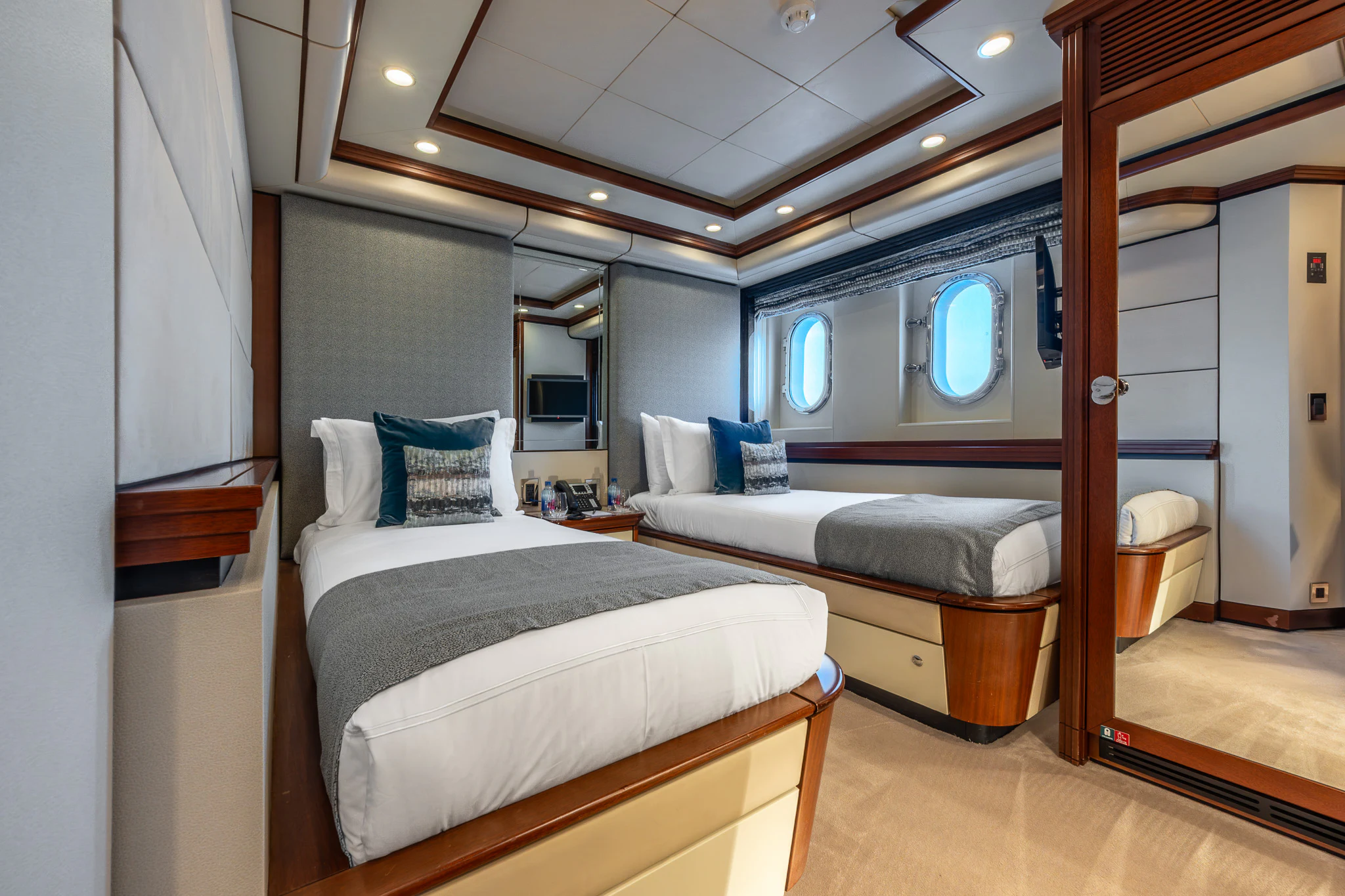 a room with two beds aboard TITIAN PEARL Yacht for Sale