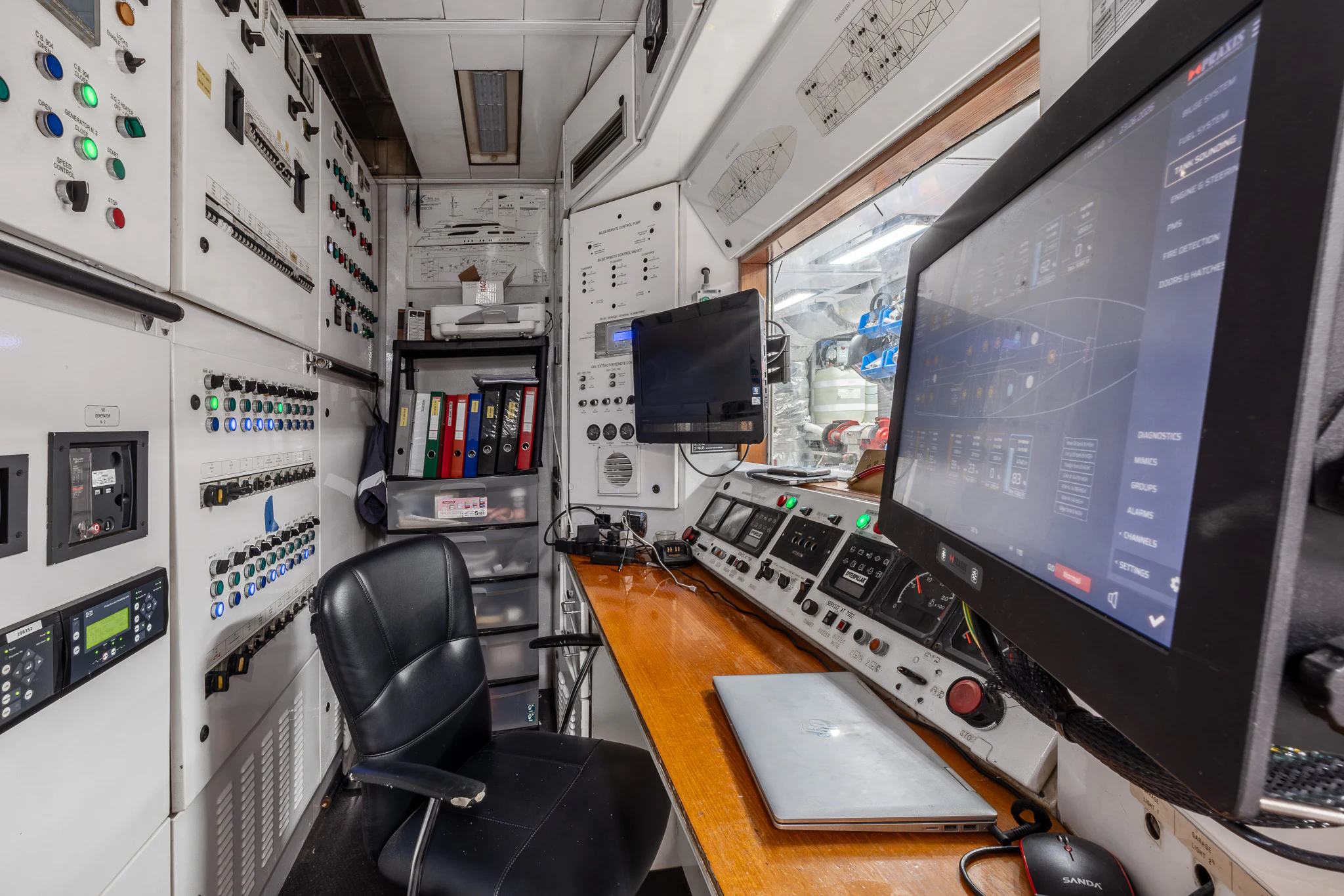 a computer on a desk aboard TITIAN PEARL Yacht for Sale