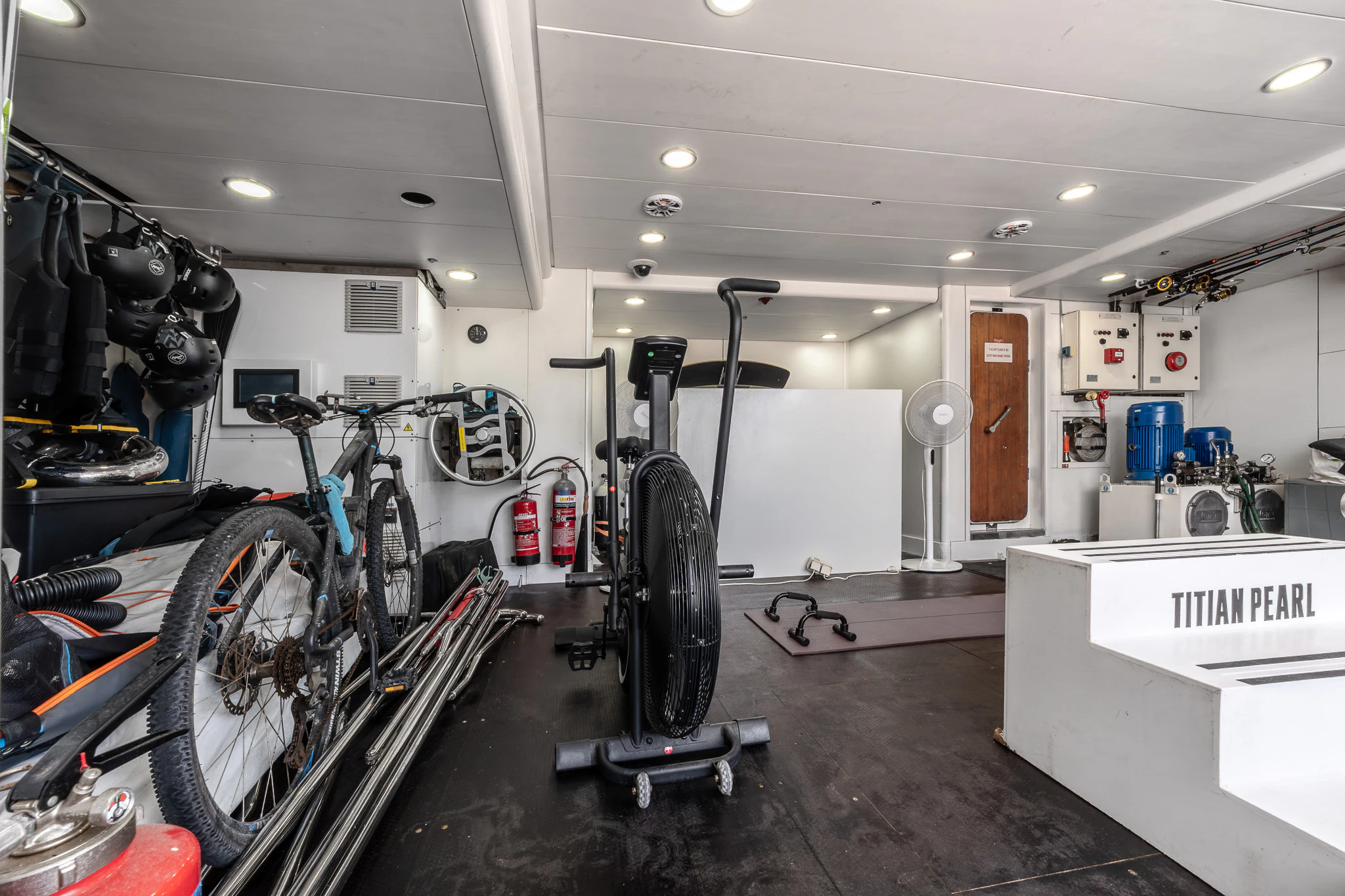 a bicycle in a garage aboard TITIAN PEARL Yacht for Sale