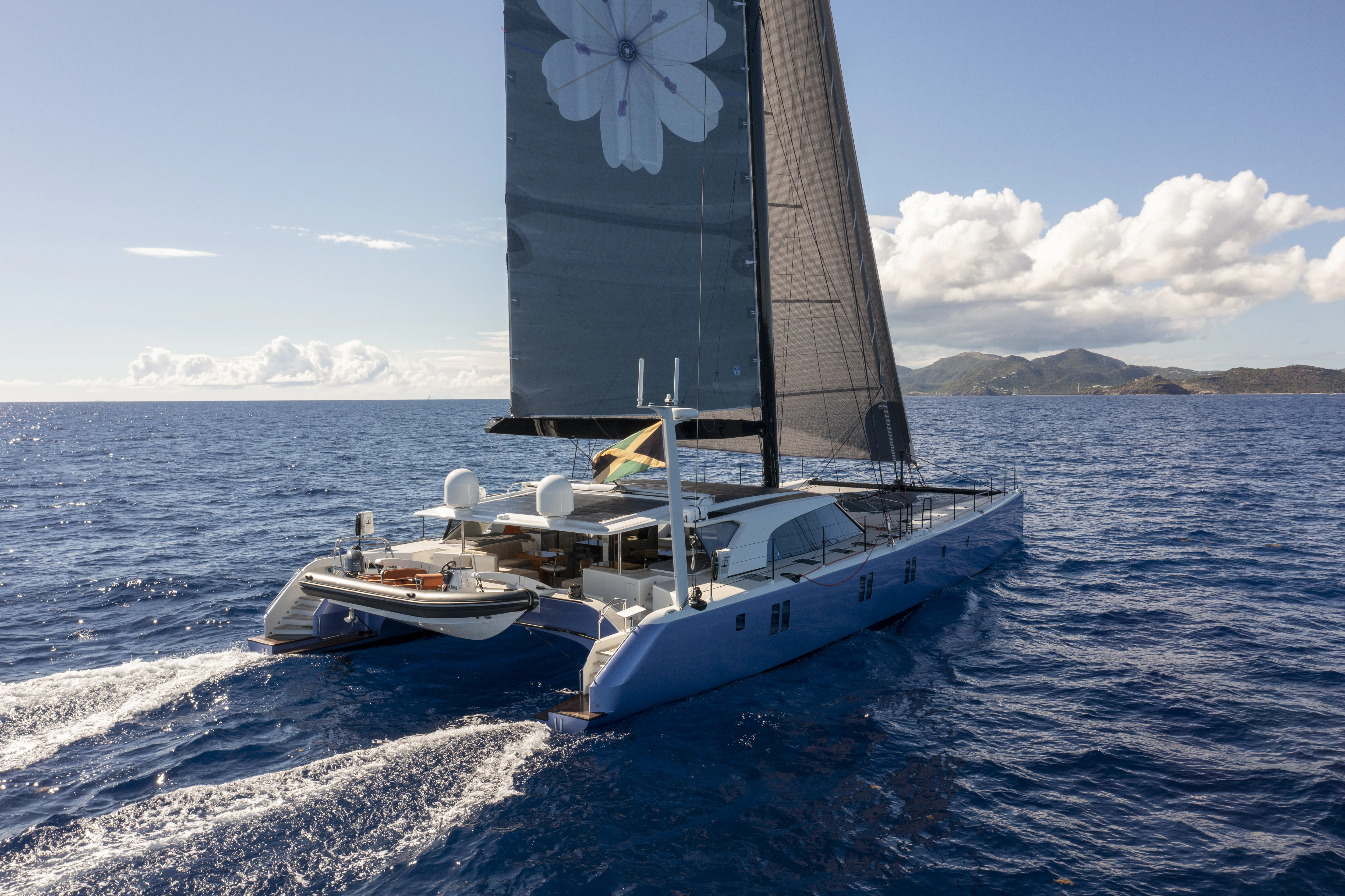 a couple of boats on the water aboard TIGER LILY TOO Yacht for Sale