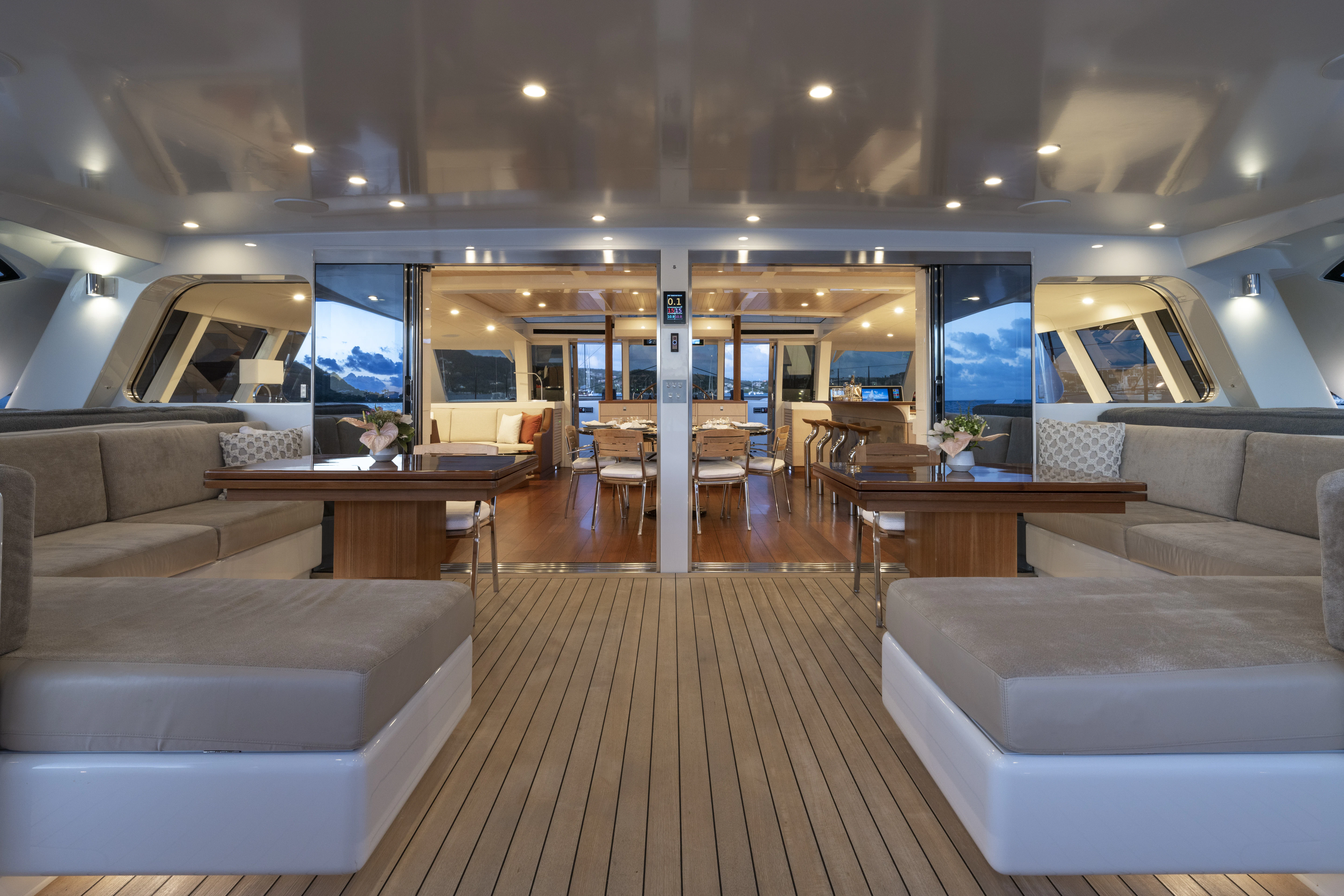 a room with couches and tables aboard TIGER LILY TOO Yacht for Sale