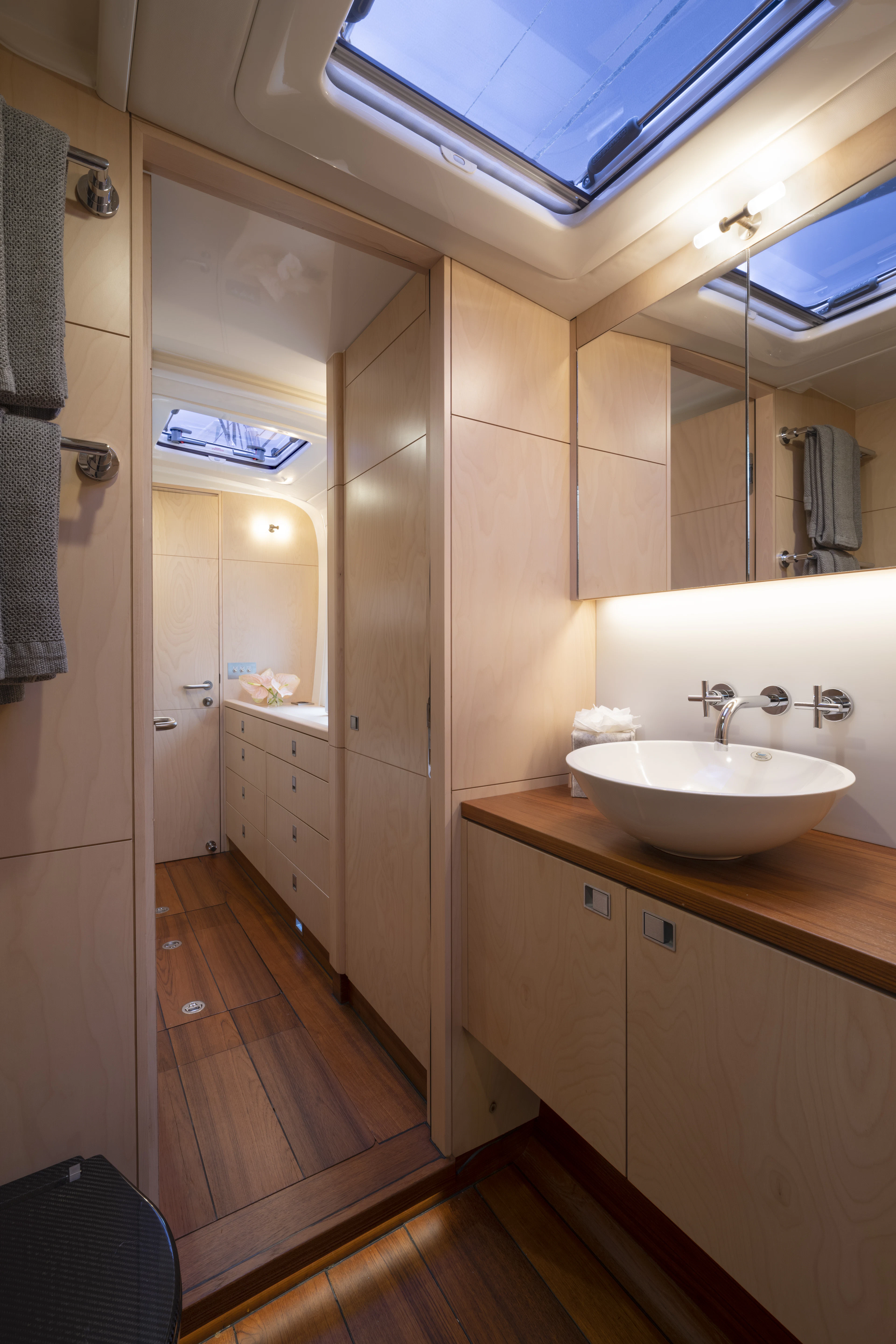 a bathroom with a sink and a mirror aboard TIGER LILY TOO Yacht for Sale