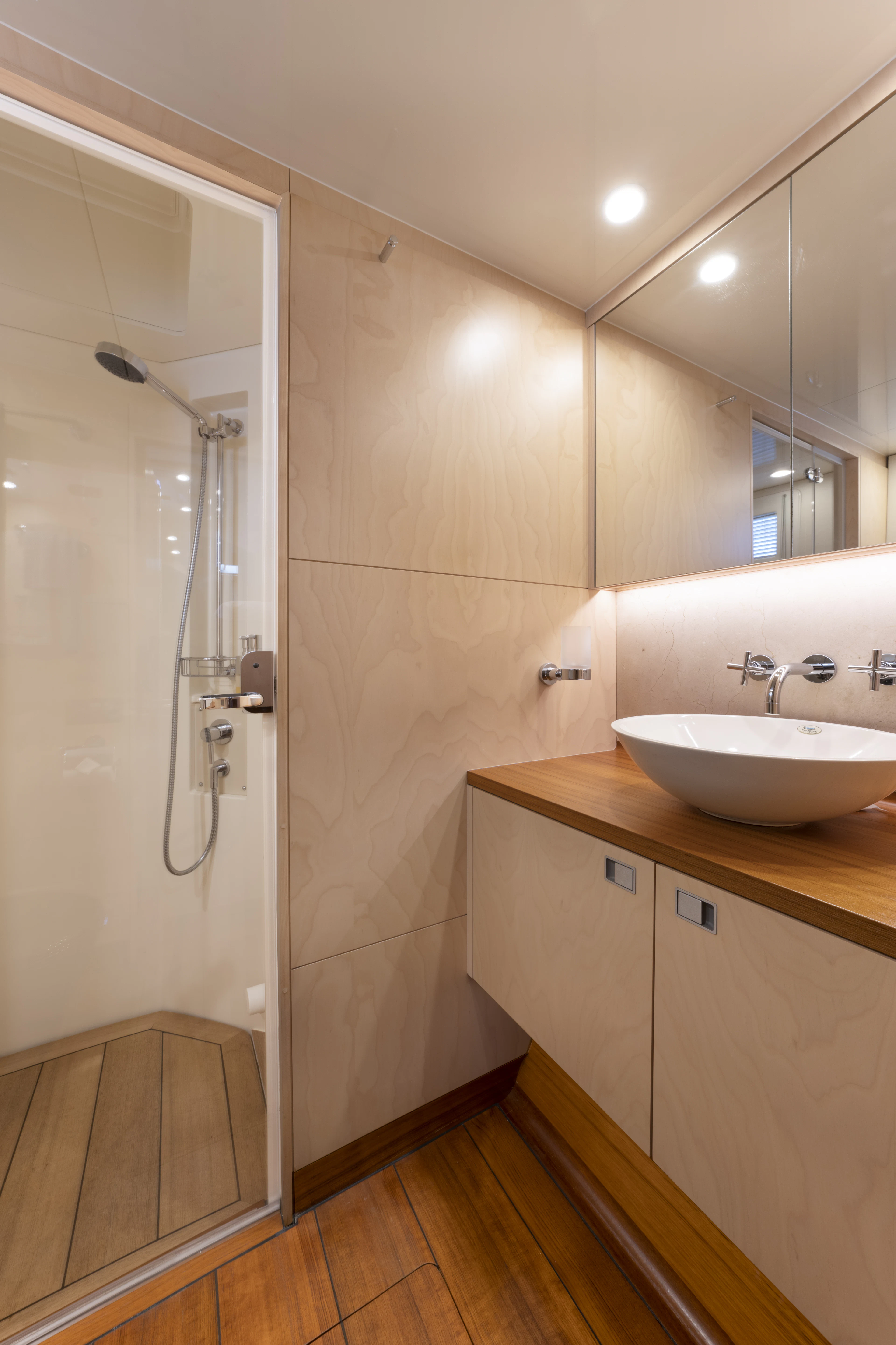 a bathroom with a shower and sink aboard TIGER LILY TOO Yacht for Sale