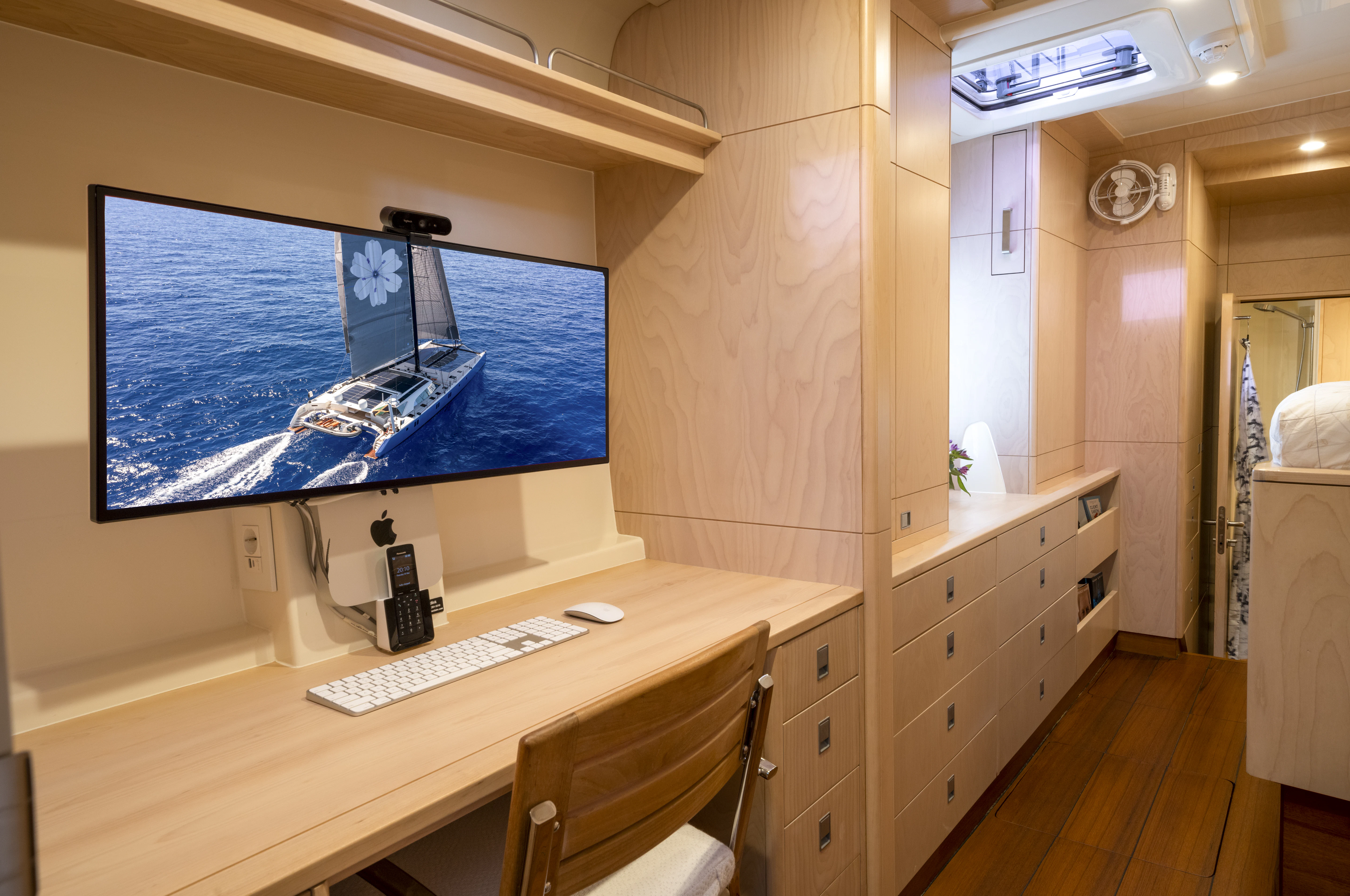 a room with a desk and a computer aboard TIGER LILY TOO Yacht for Sale