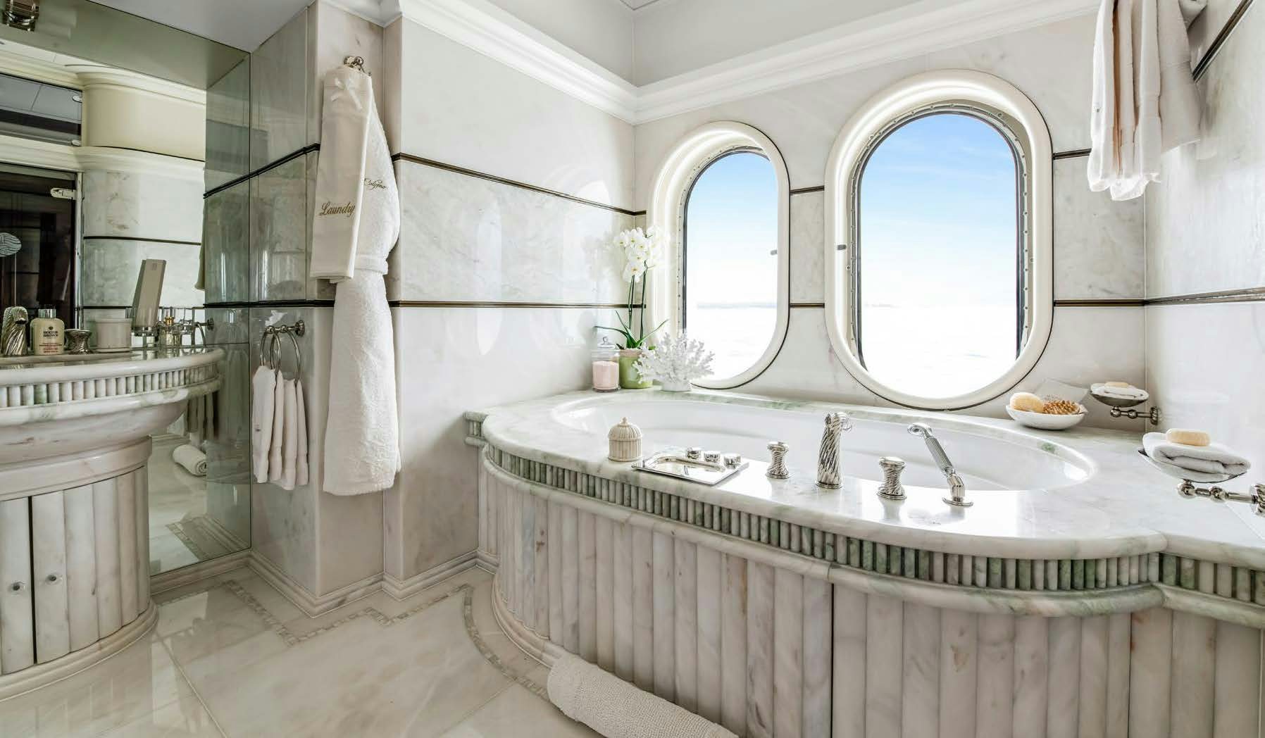 a bathroom with a large white countertop aboard CALYPSO Yacht for Sale