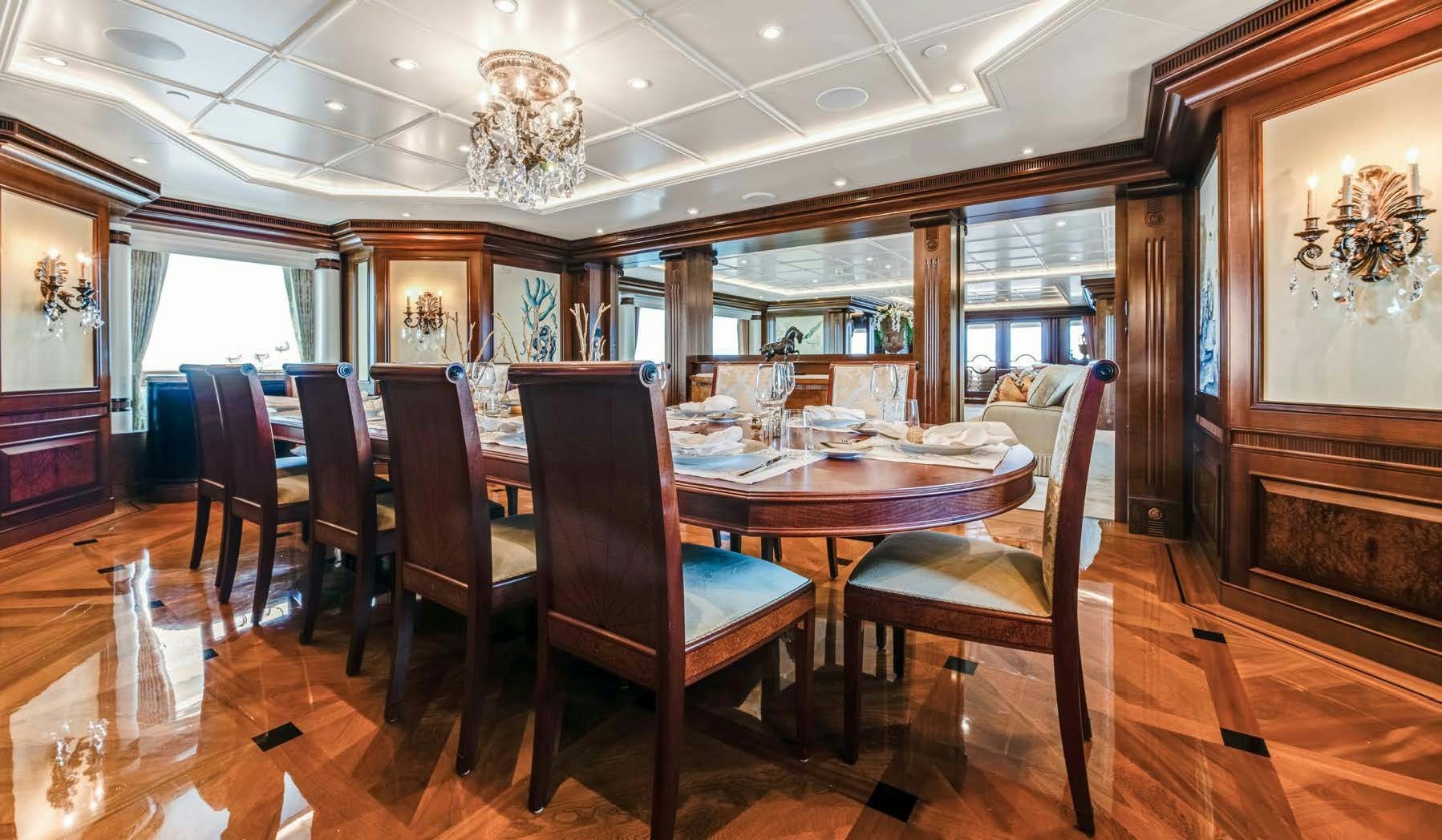 a dining room with a table and chairs aboard CALYPSO Yacht for Sale