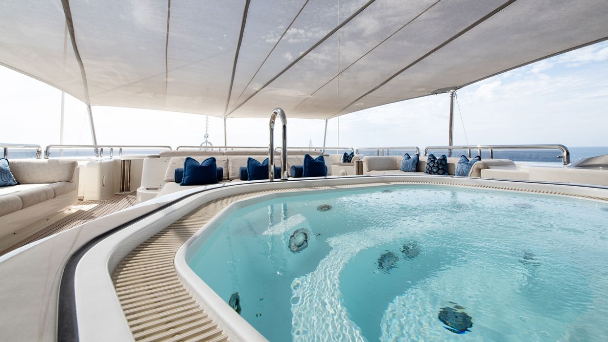 a boat with a pool aboard CALYPSO Yacht for Sale