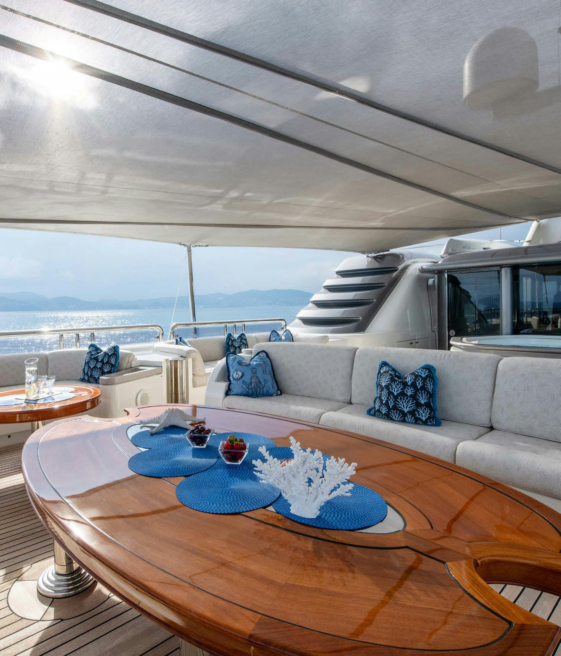 a living room with a large balcony aboard CALYPSO Yacht for Sale