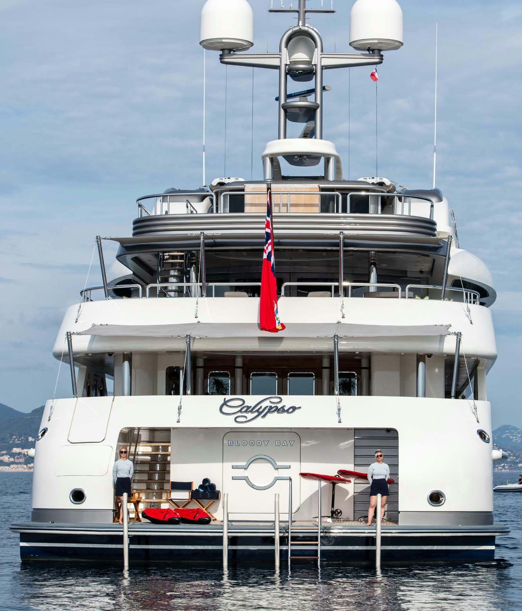 a large white boat with a red stripe on the front aboard CALYPSO Yacht for Sale
