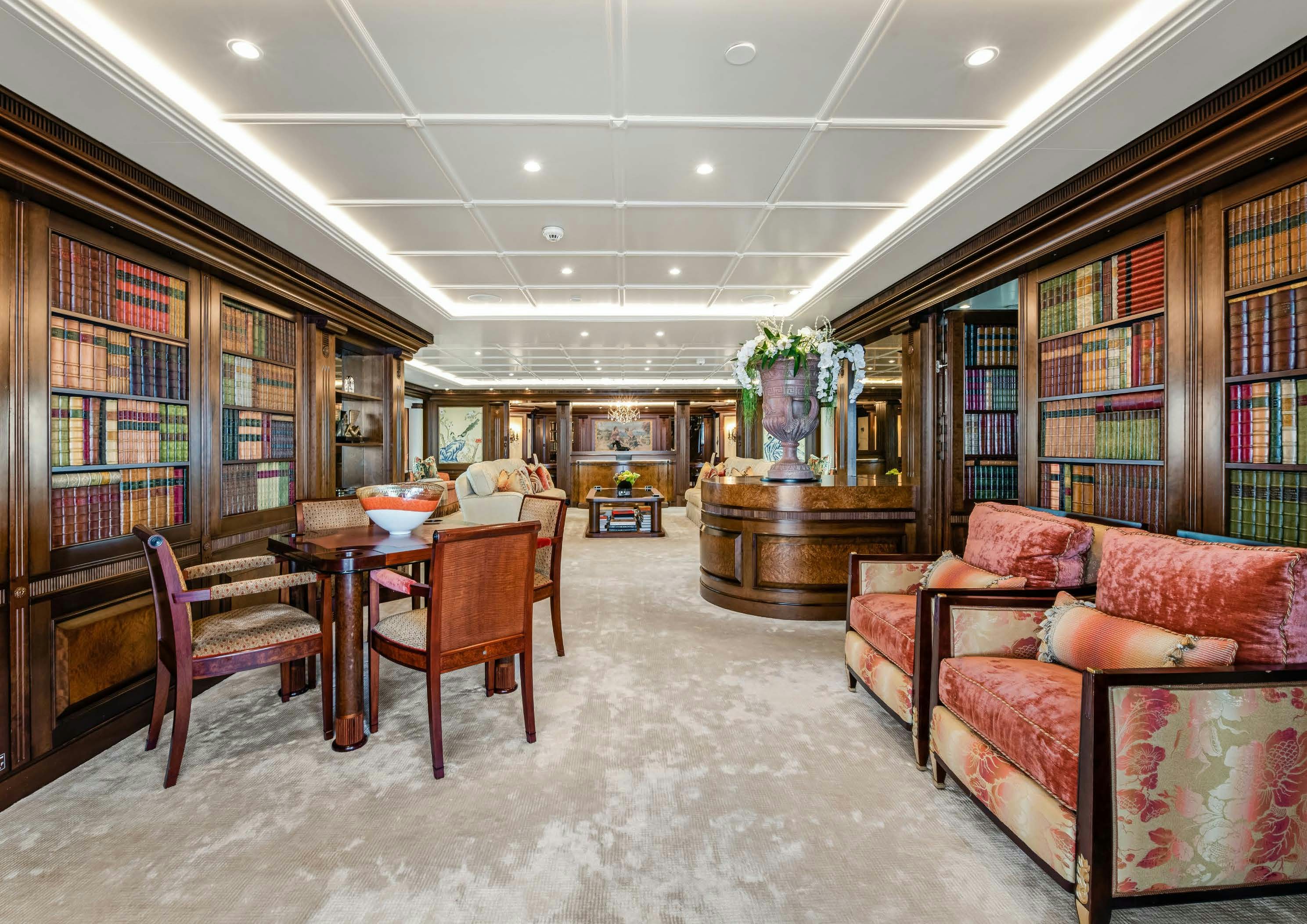 a room with a couch and a table and chairs aboard CALYPSO Yacht for Sale