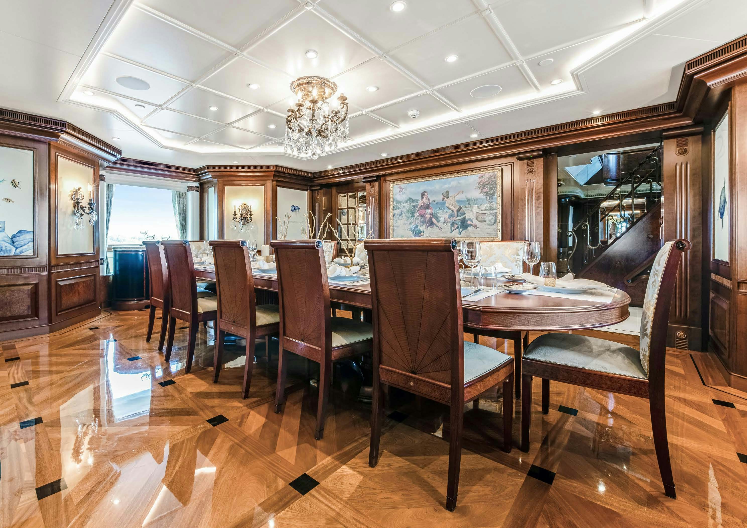 a dining room with a table and chairs aboard CALYPSO Yacht for Sale