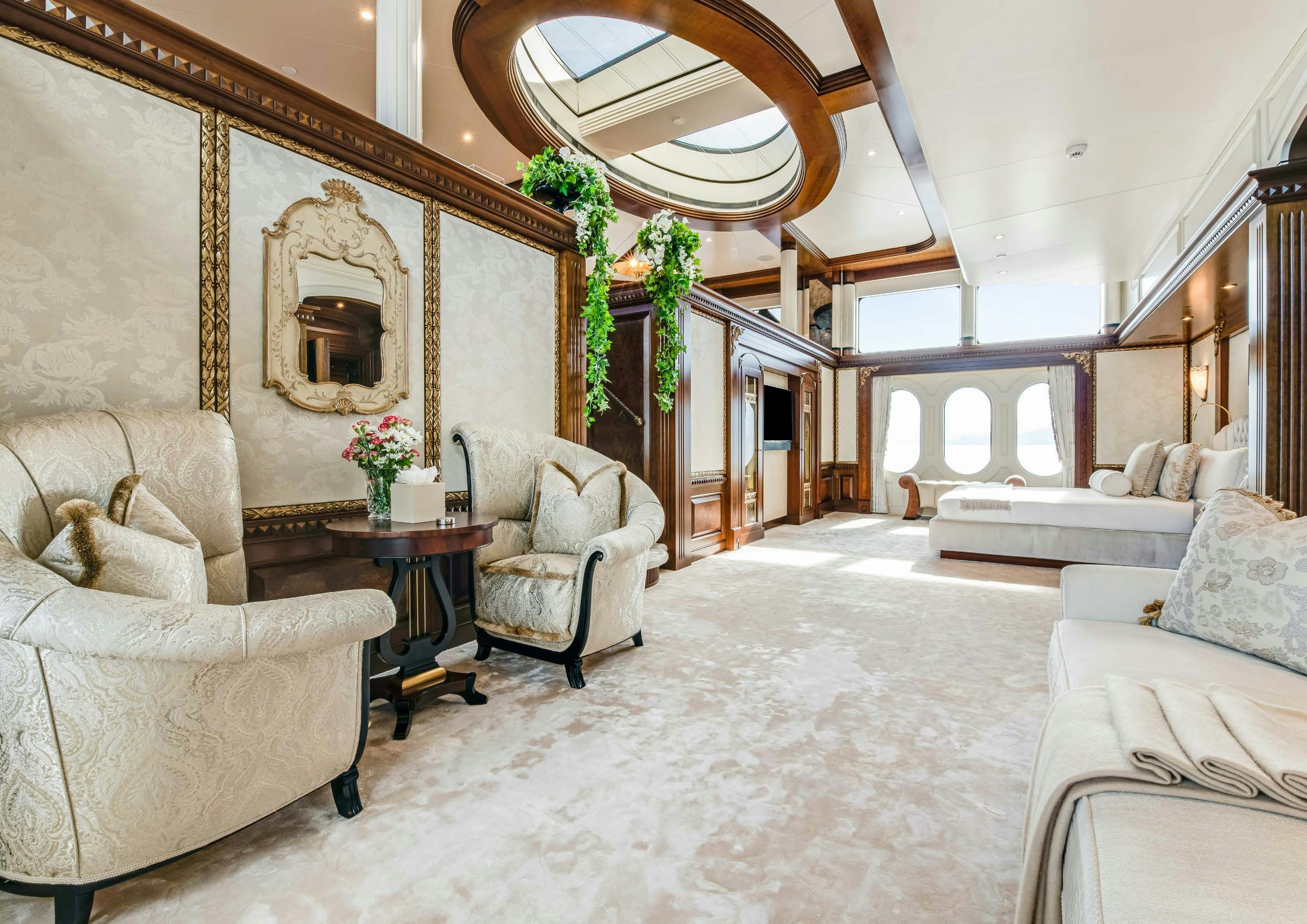 a large living room with a large open door aboard CALYPSO Yacht for Sale