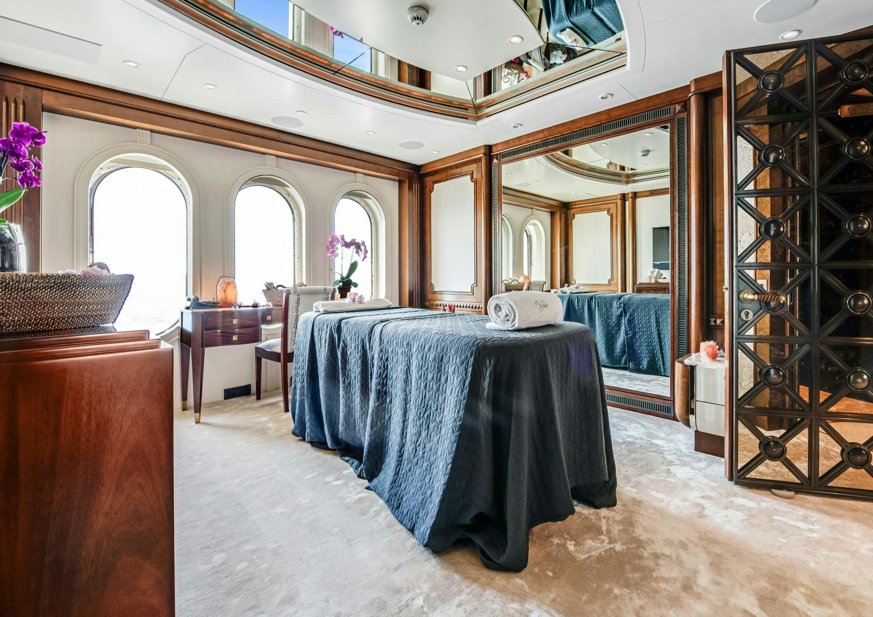 a large room with a table and chairs aboard CALYPSO Yacht for Sale