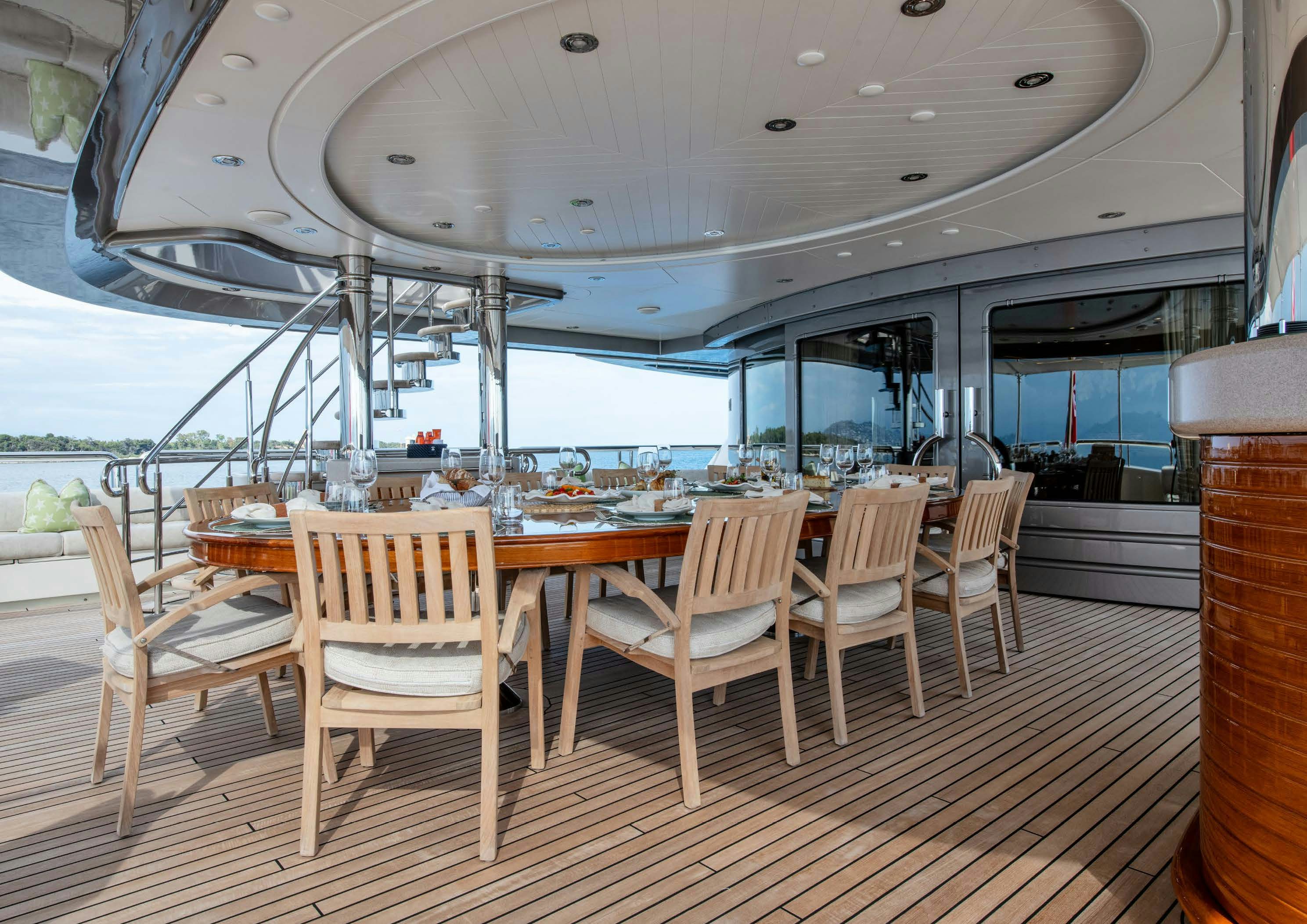 a room with a table and chairs aboard CALYPSO Yacht for Sale