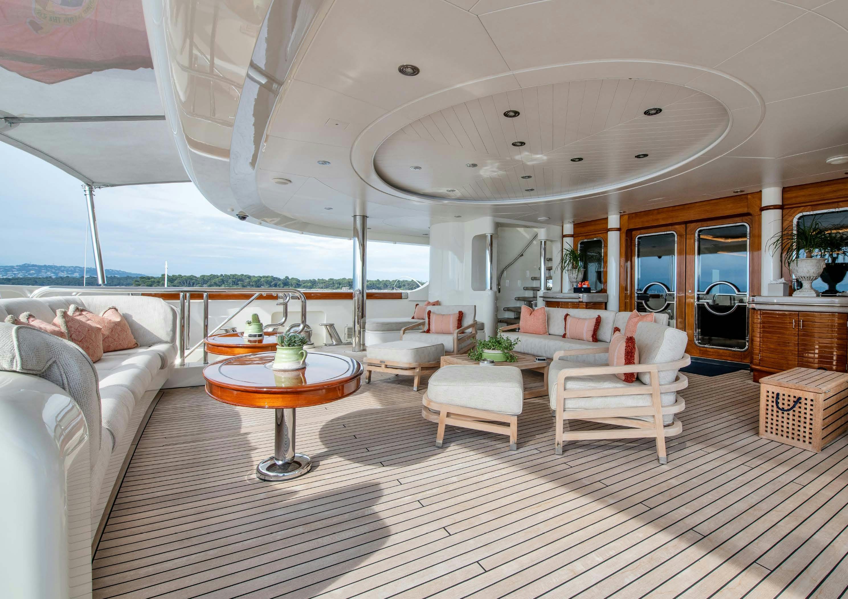 a large living room with a large balcony aboard CALYPSO Yacht for Sale