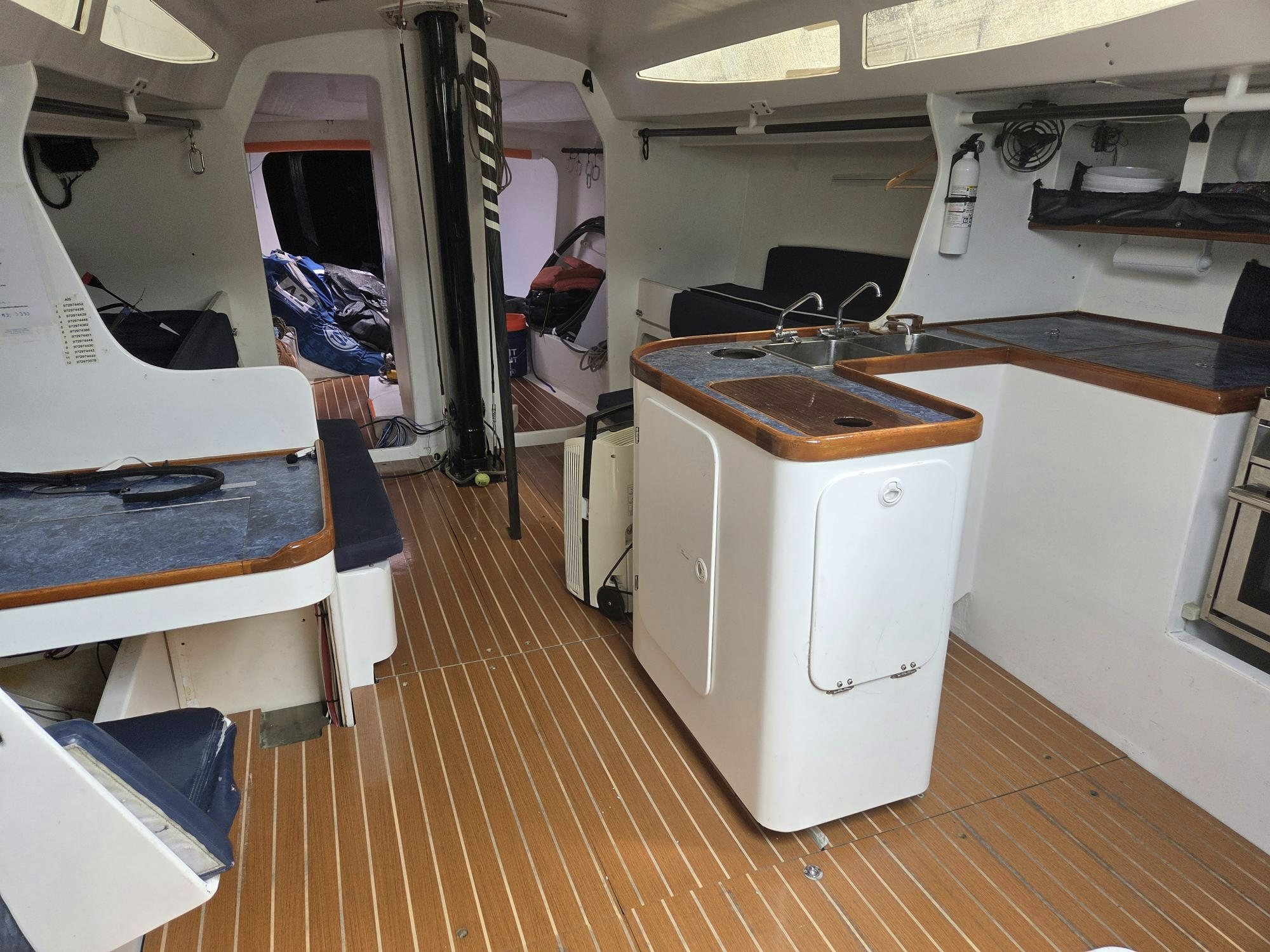 a room with a washing machine and a sink aboard PELIGROSO Yacht for Sale
