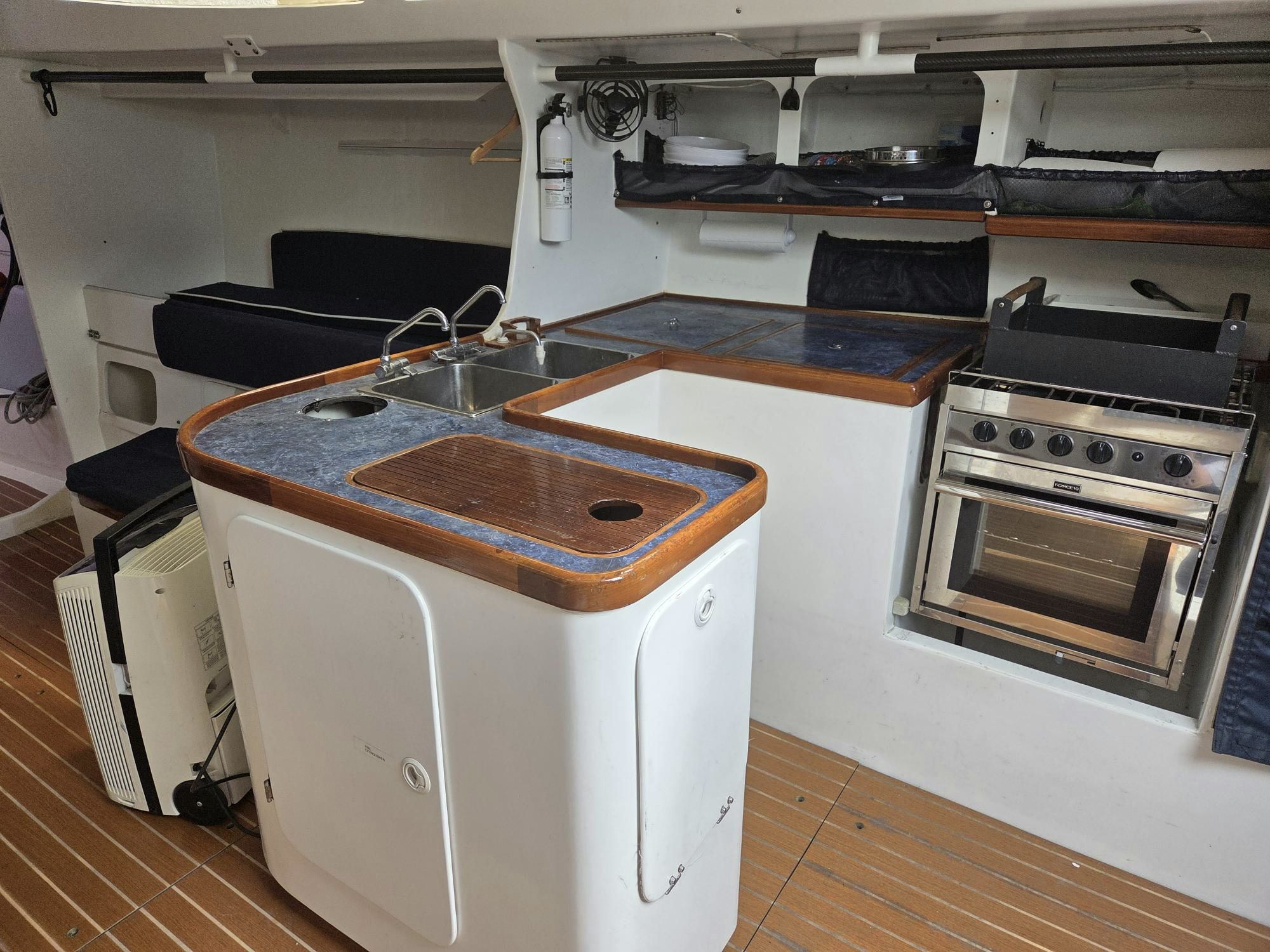 a kitchen with a stove and sink aboard PELIGROSO Yacht for Sale