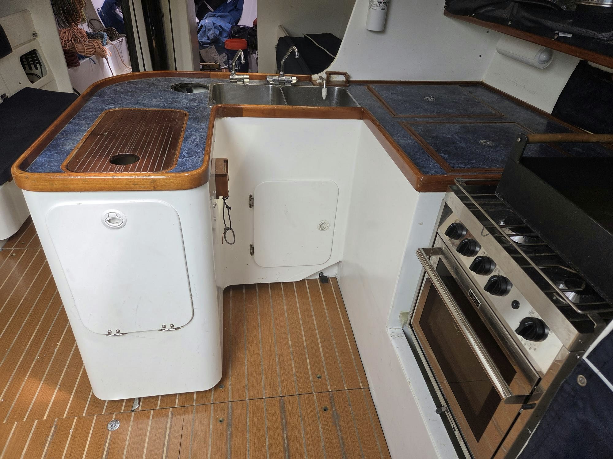 a kitchen with a stove and sink aboard PELIGROSO Yacht for Sale